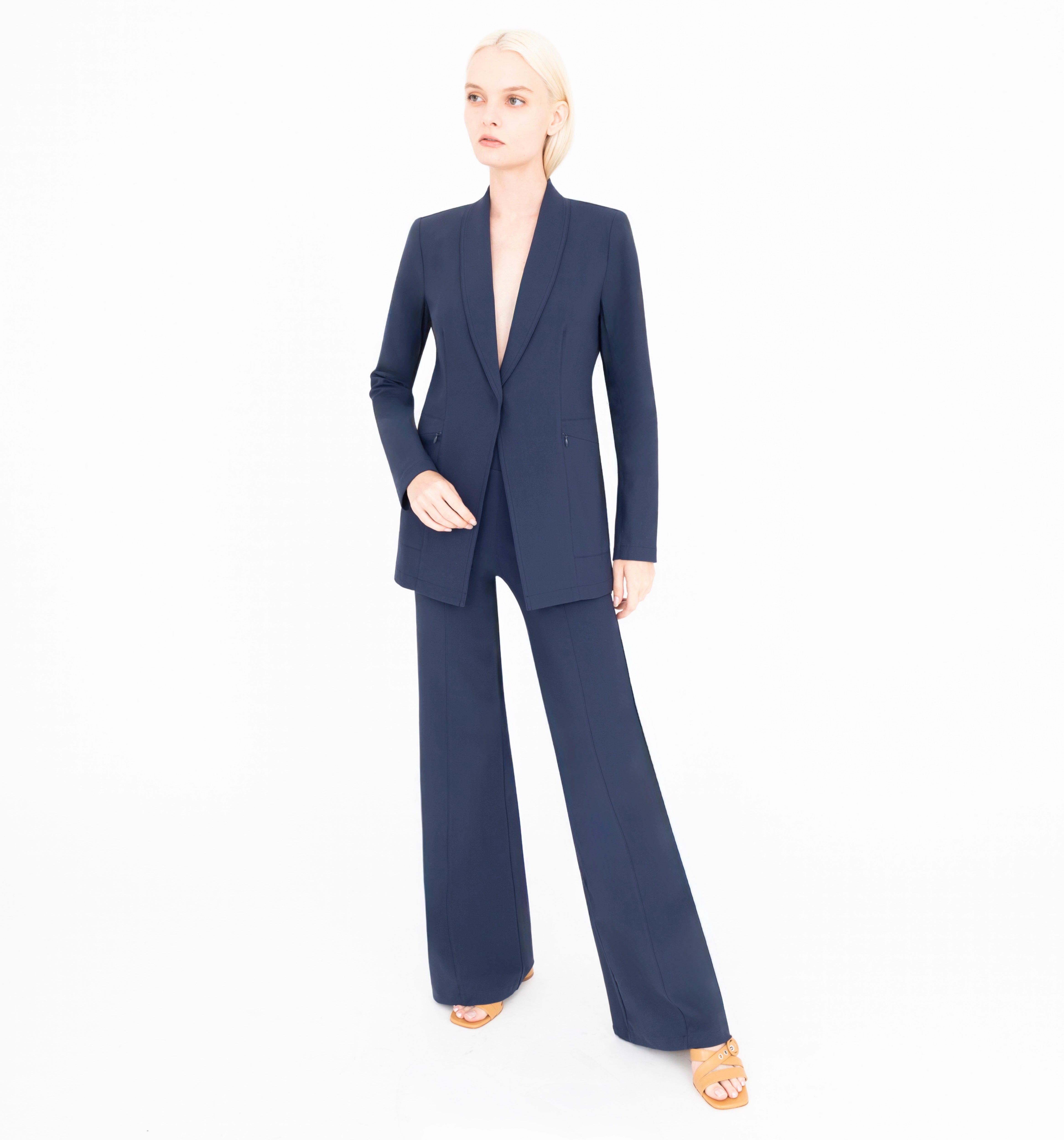 Woman wearing a navy blue suit on a white background