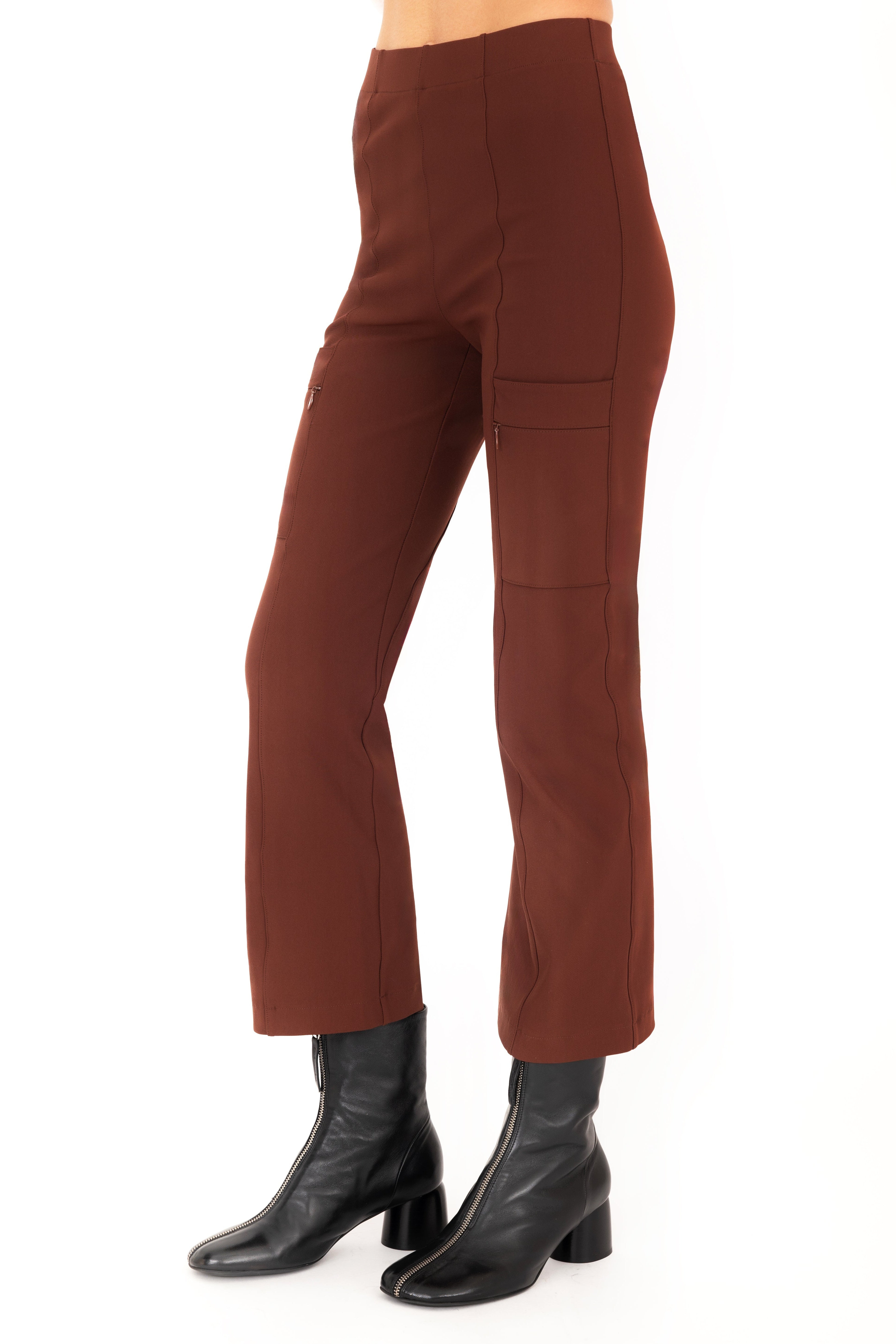 Brown pants worn by a person on a white background