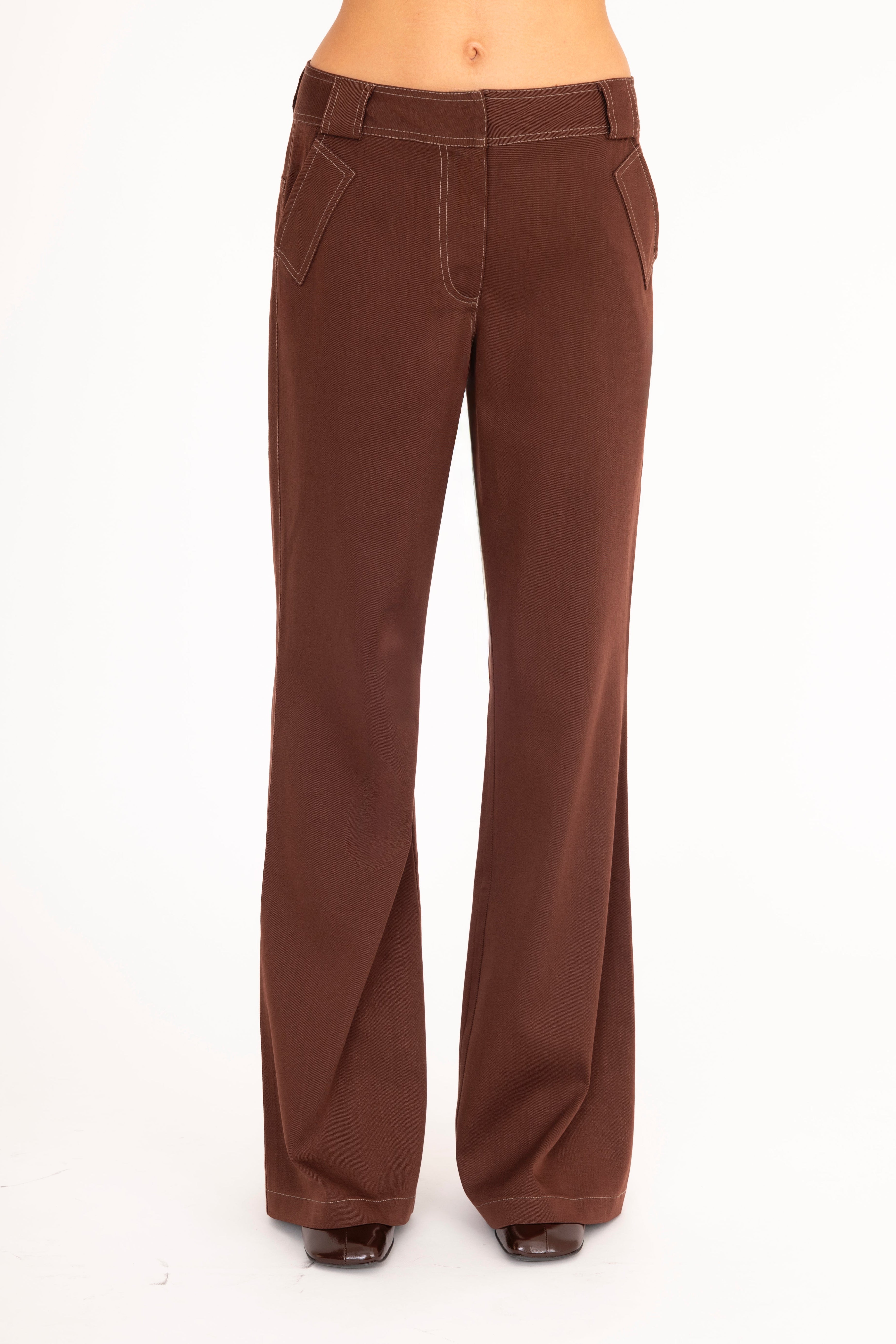 Brown flared jeans on a white background