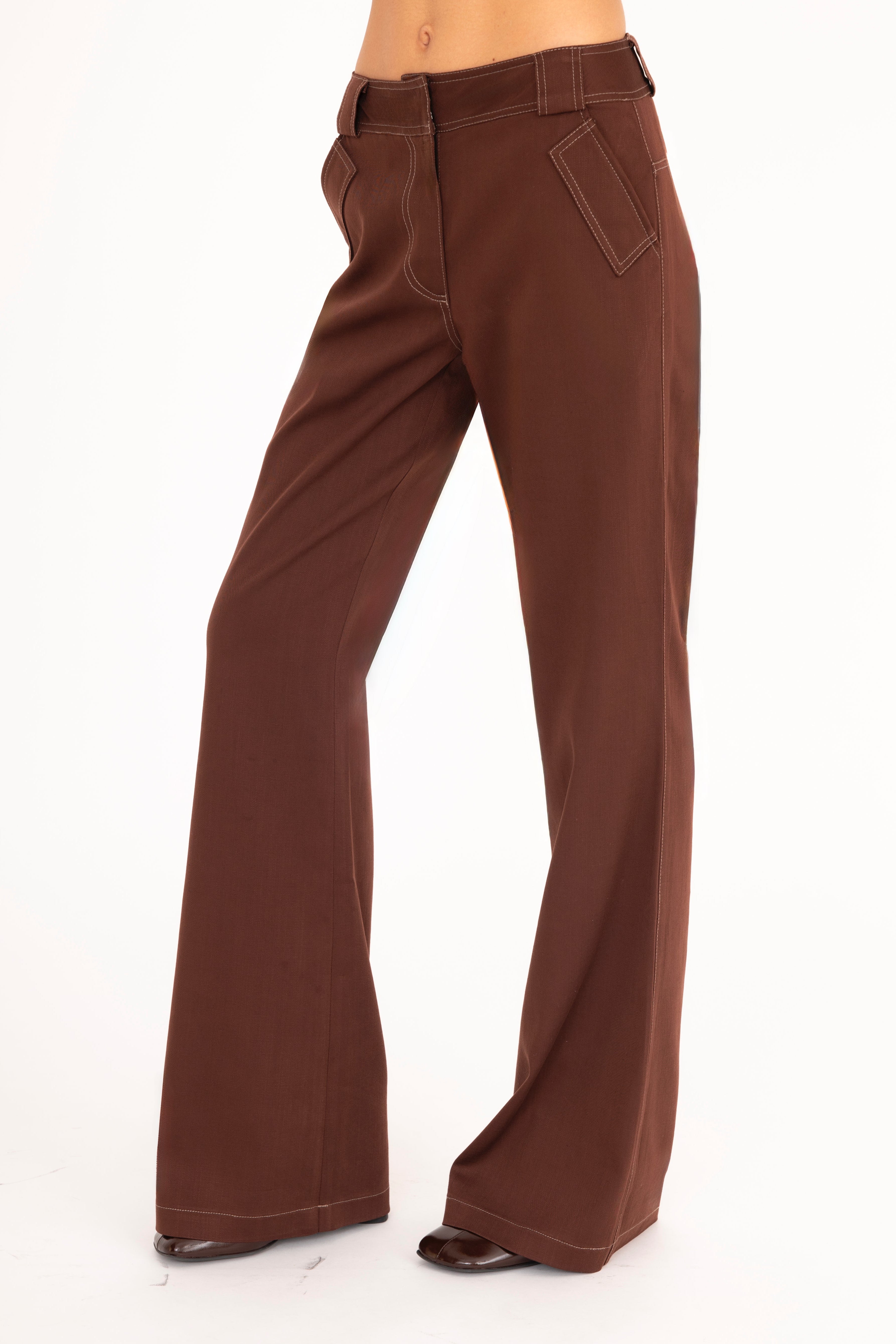 Brown flared jeans on a white background