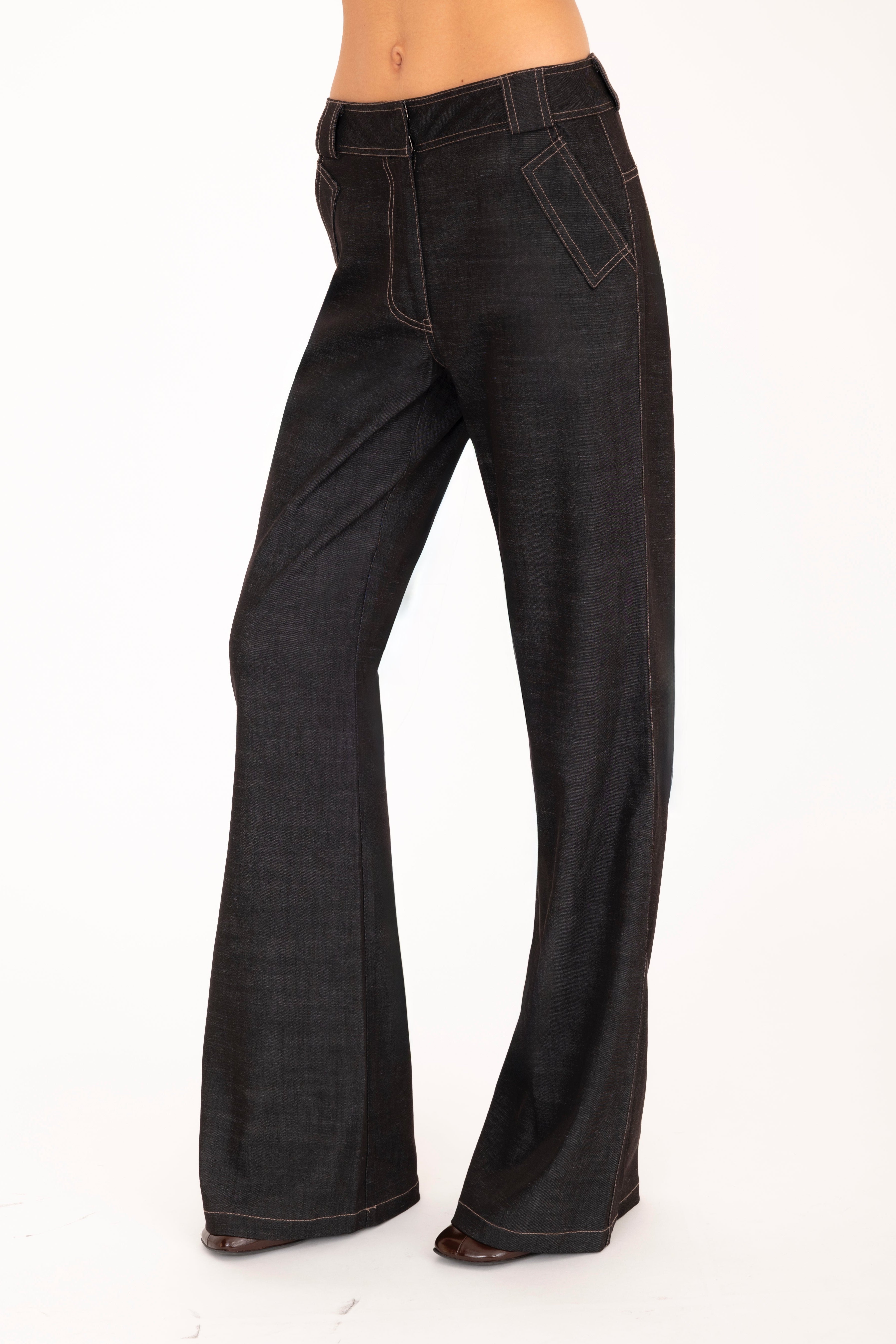 Brown flared jeans on a white background