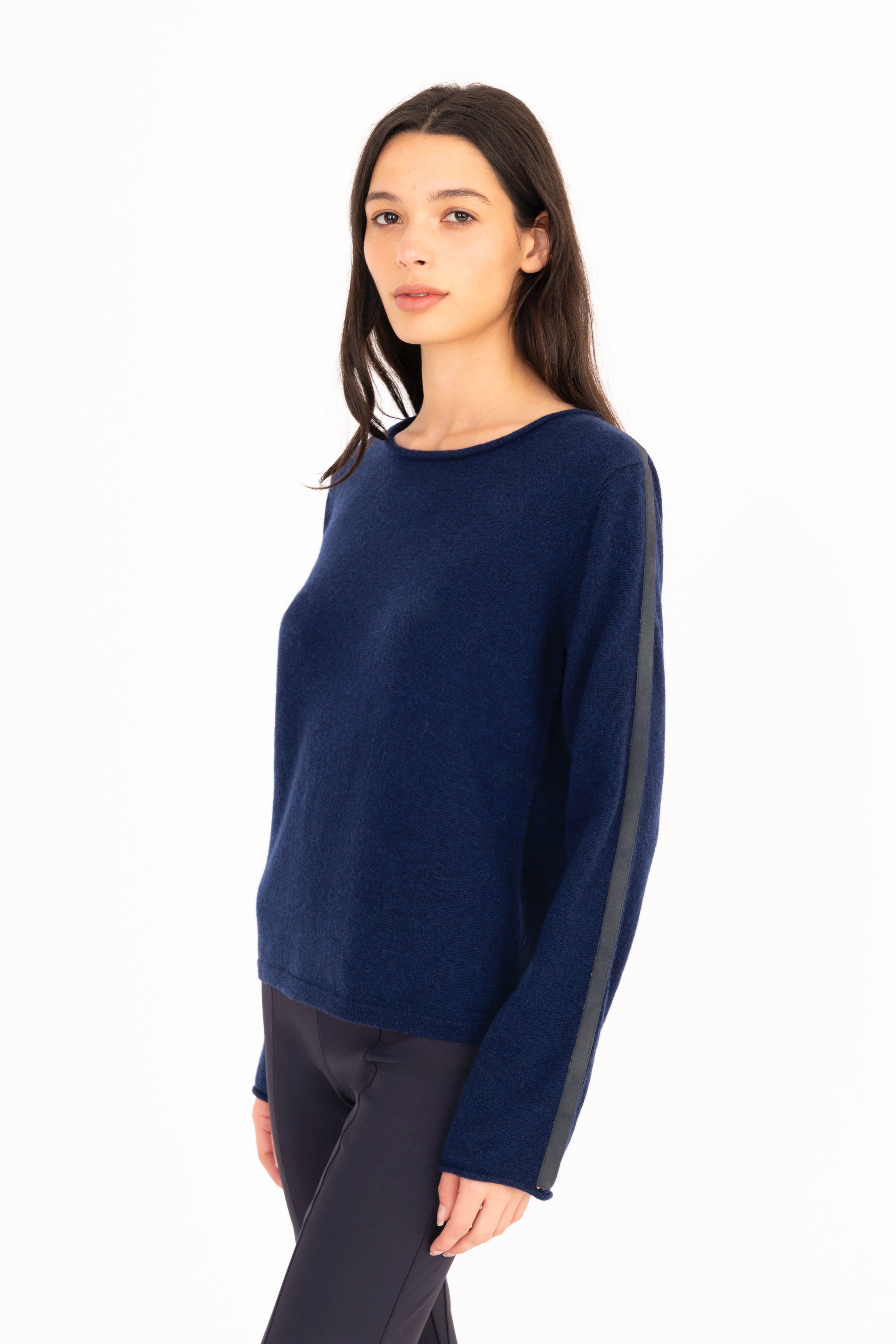Woman wearing a blue sweater on a white background