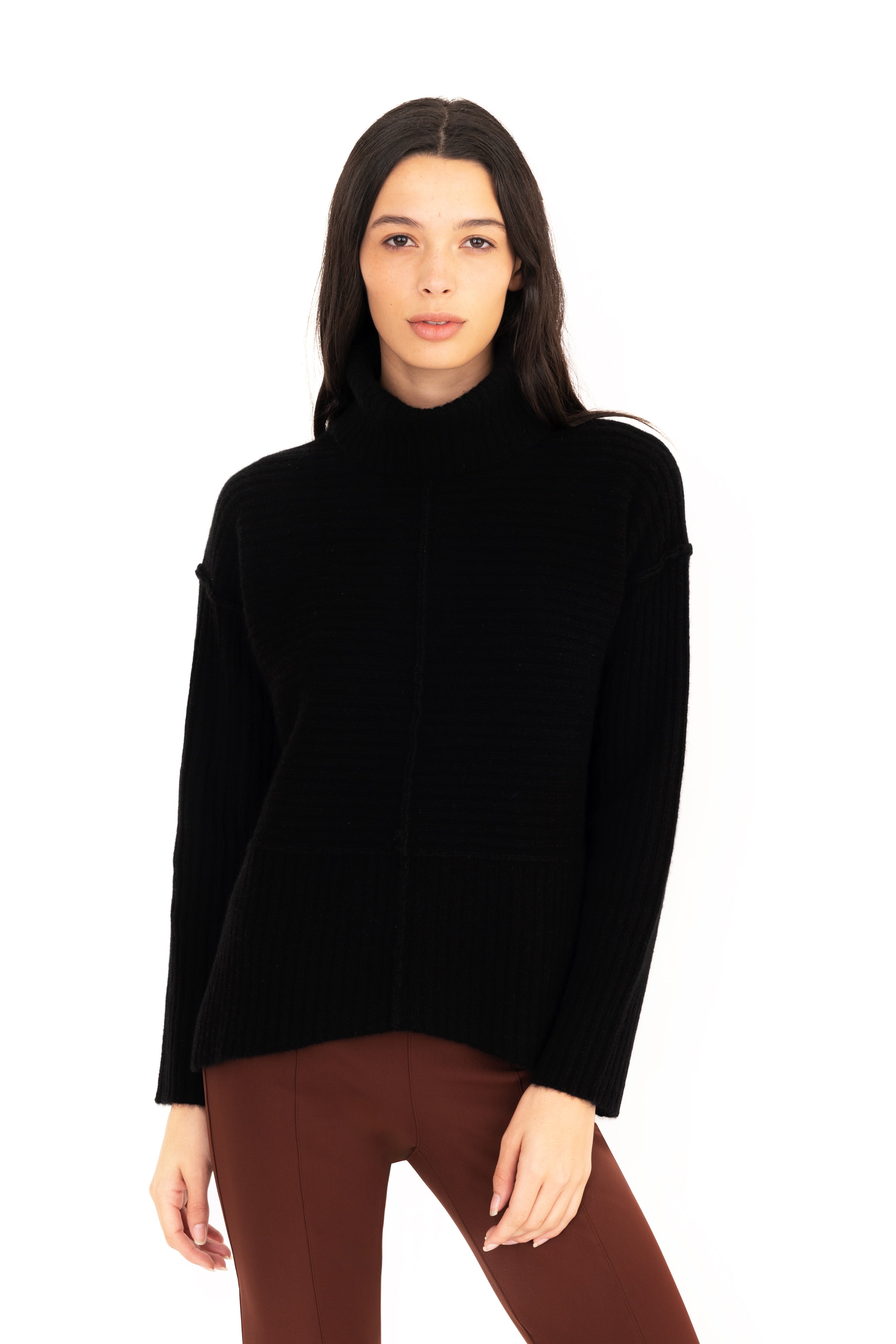 Woman wearing a black turtleneck sweater on a white background
