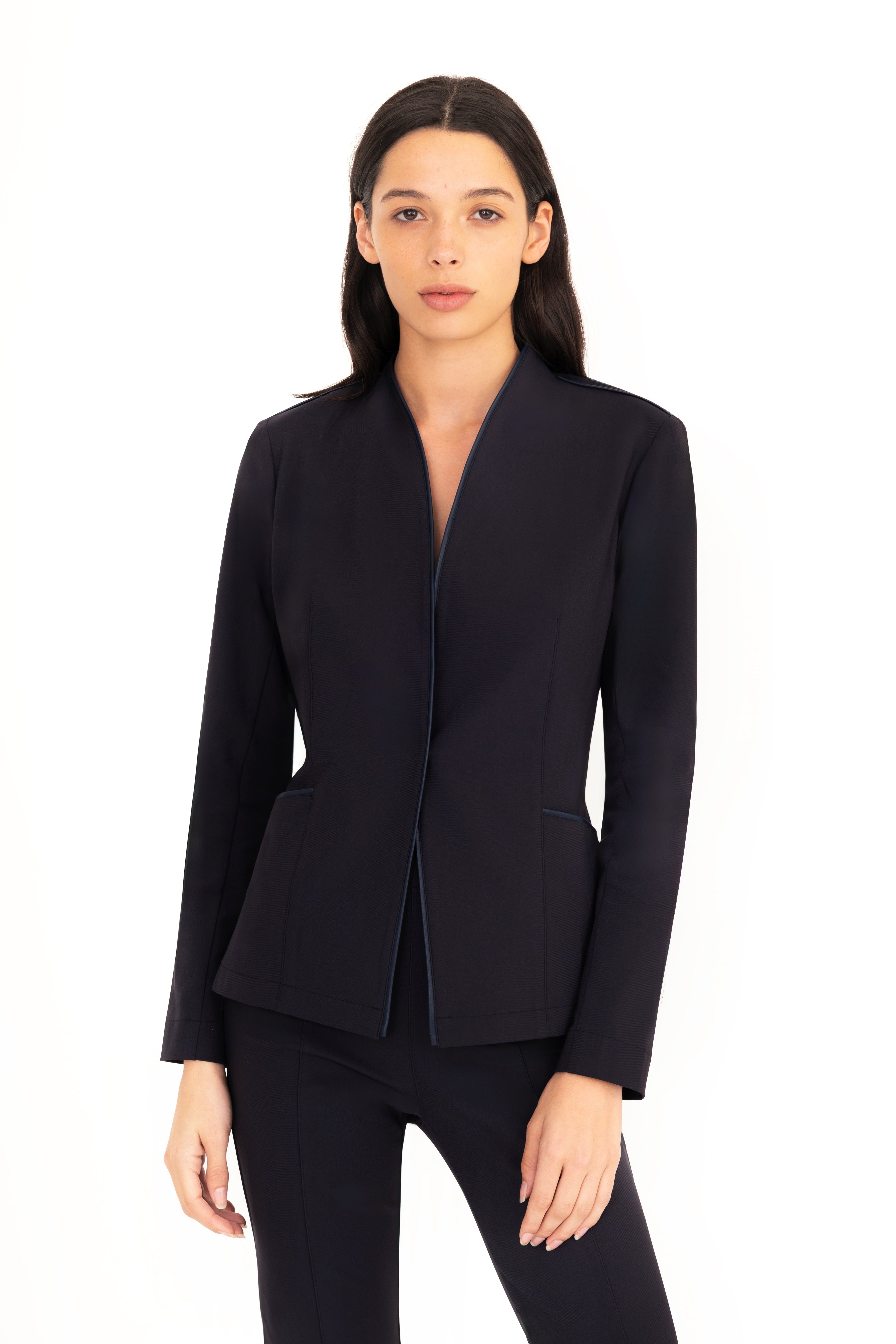 Woman wearing a dark blue blazer on a white background