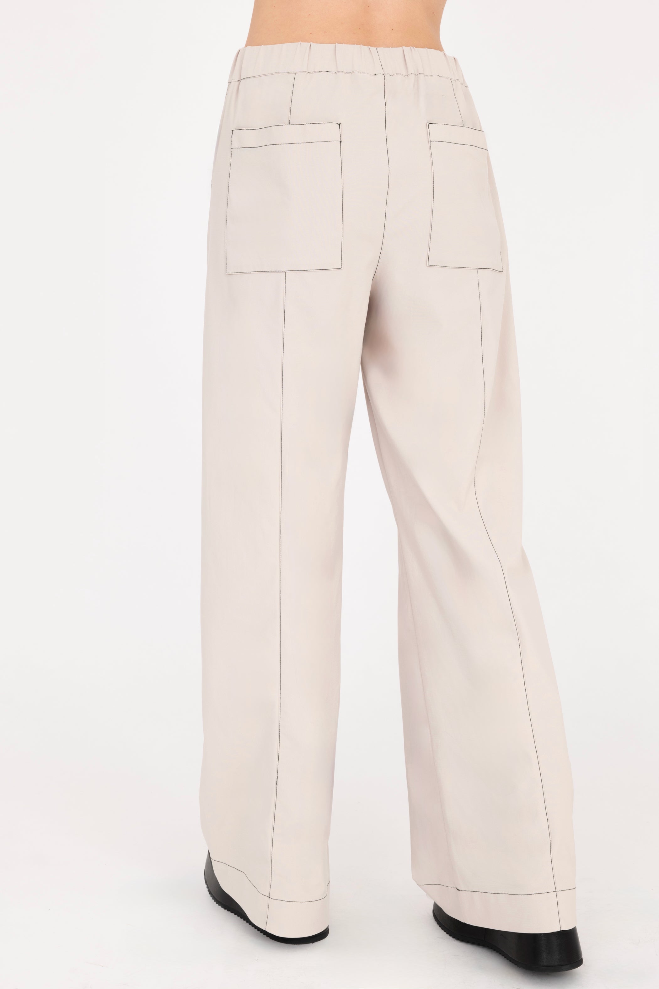 Beige wide-leg pants on a white background