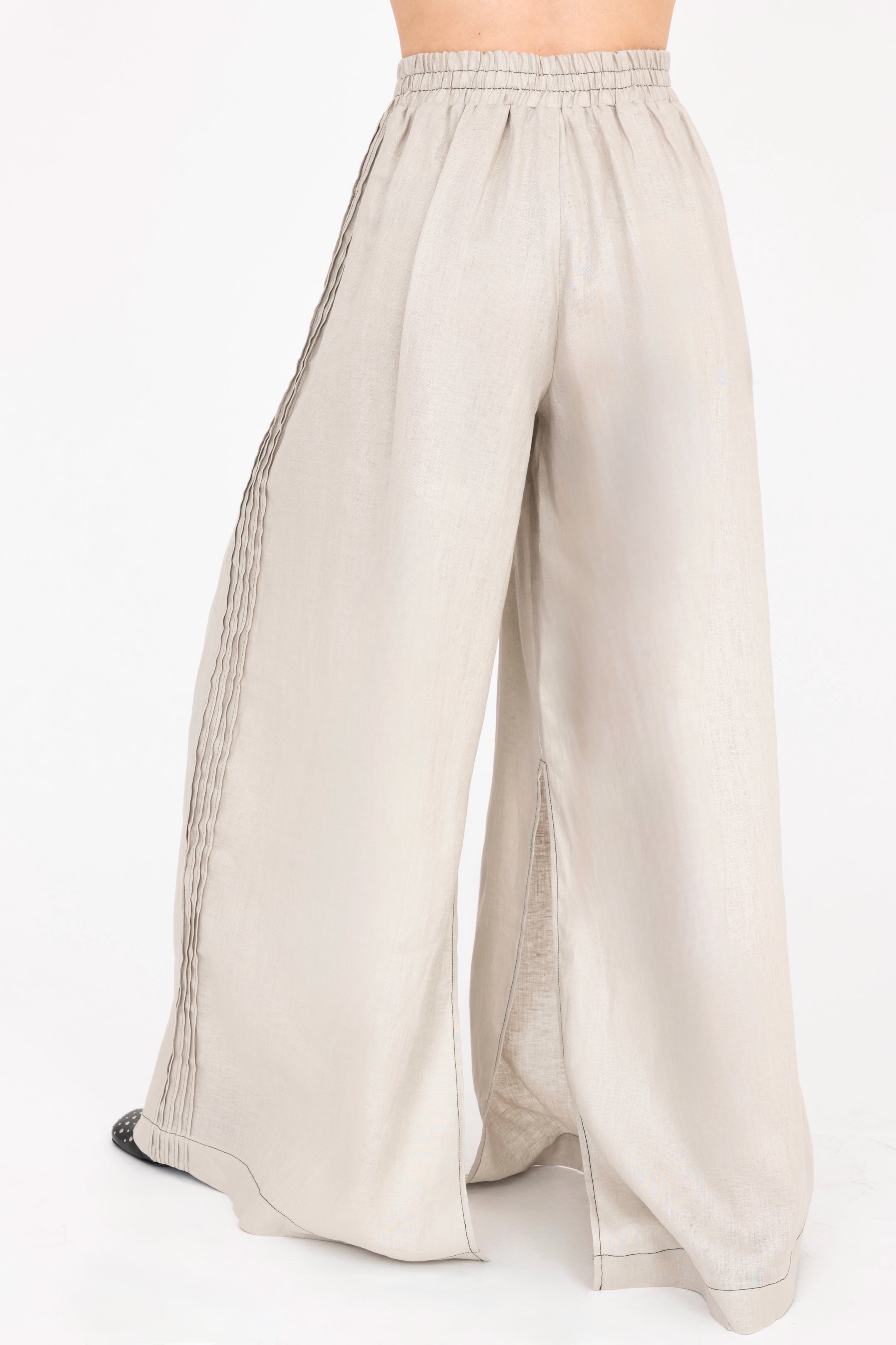 Beige wide-leg pants on a white background