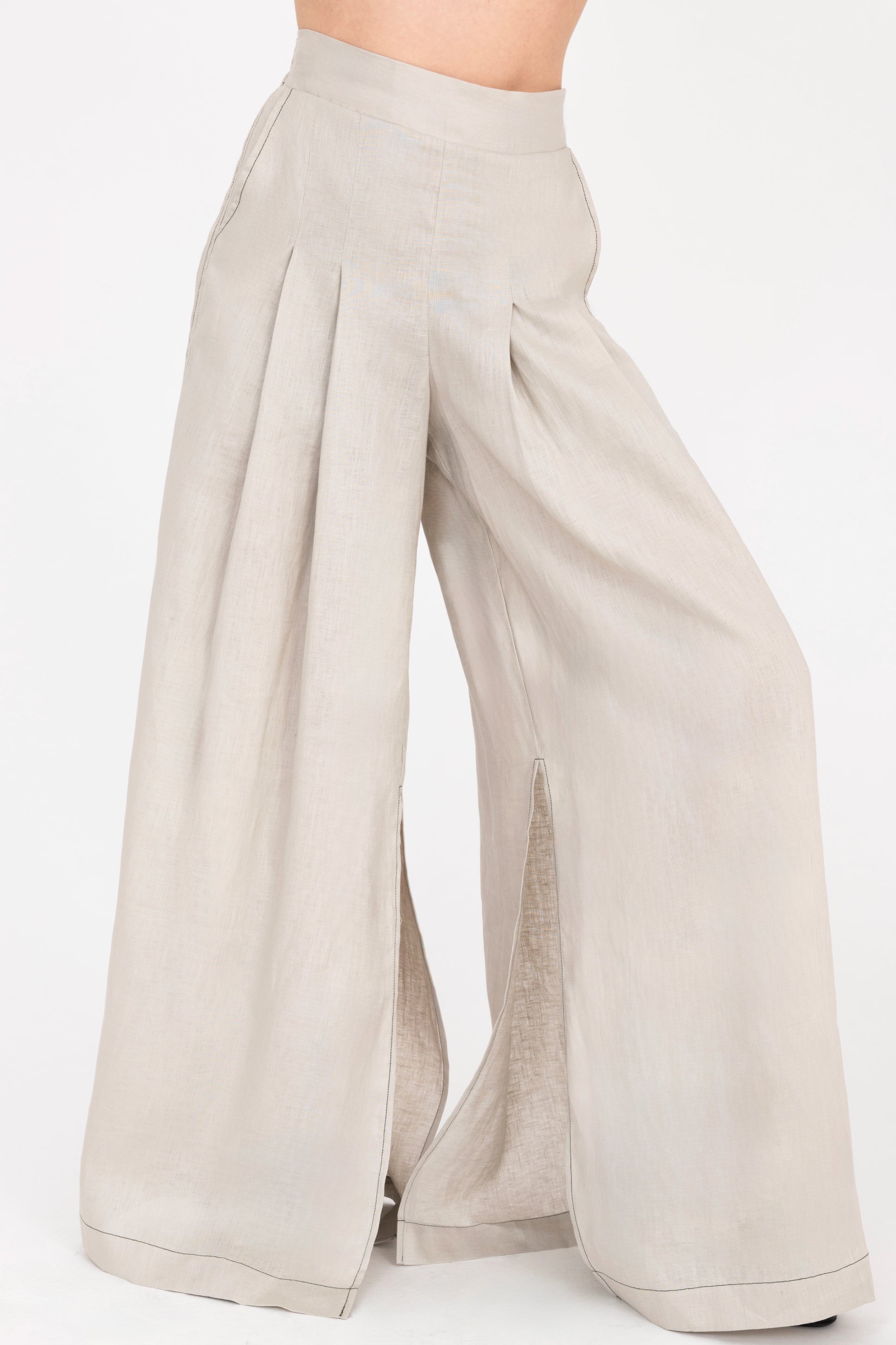 Beige wide-leg pants on a white background