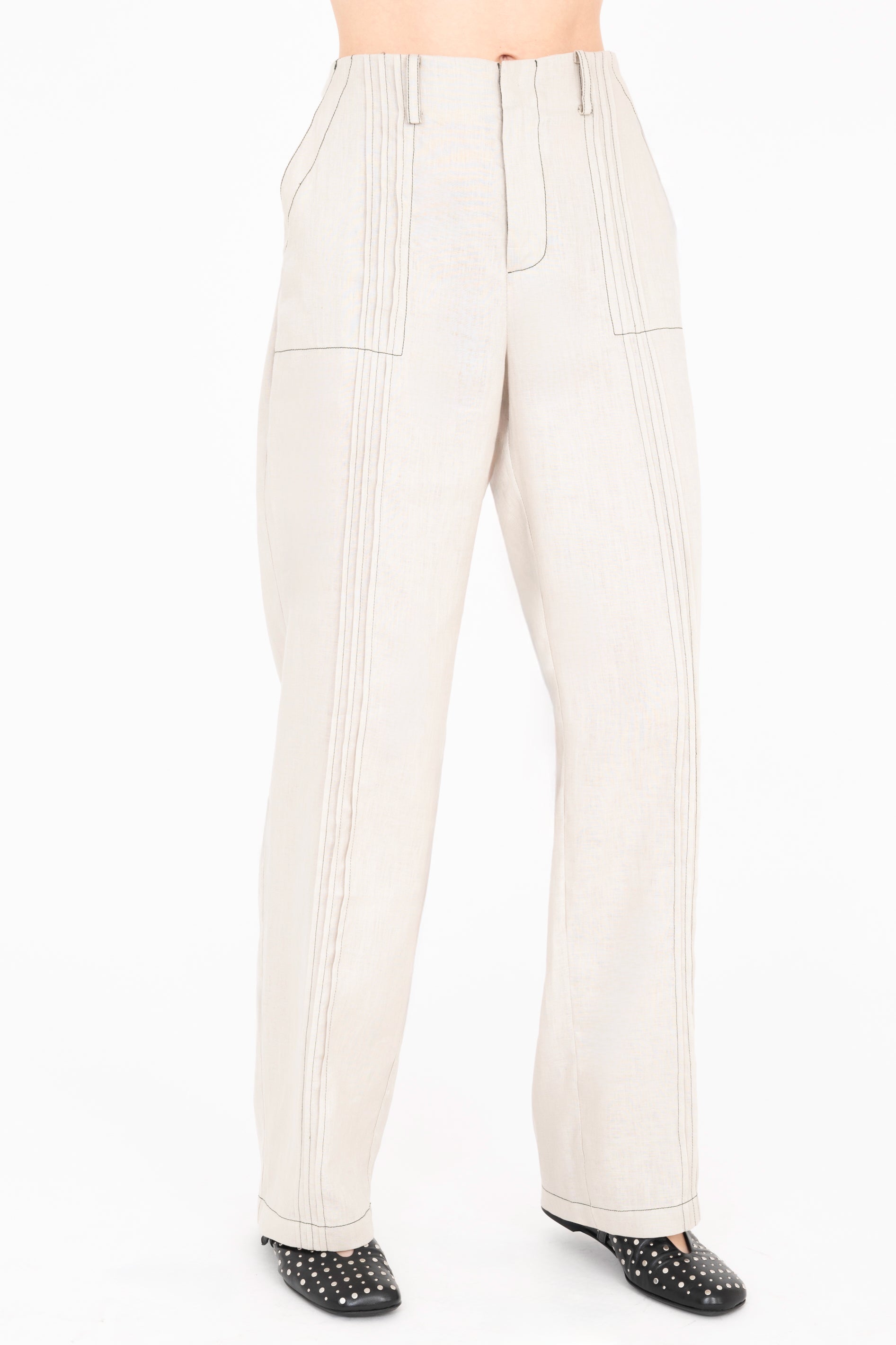 Beige pleated pants on a white background