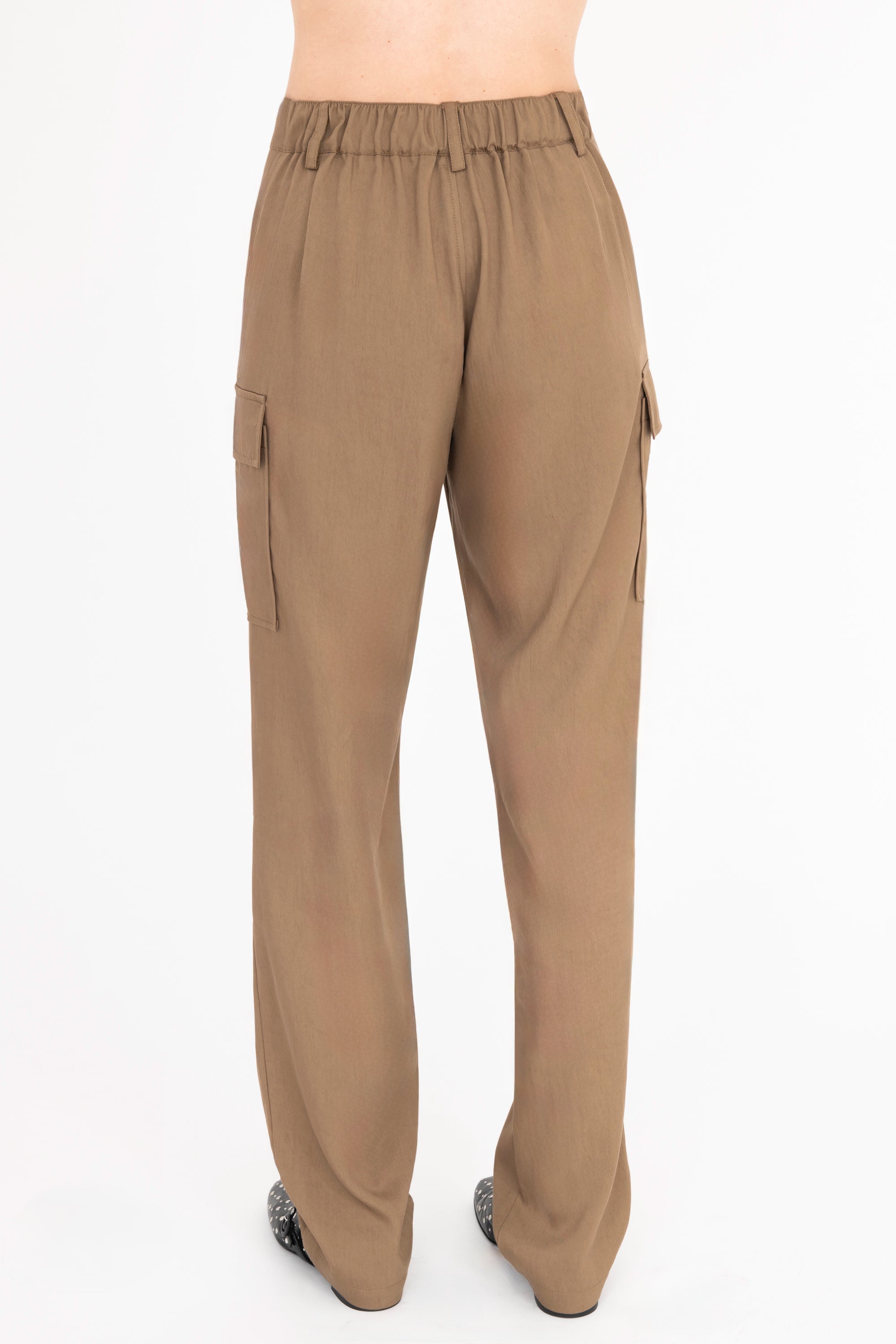 Back view of tan cargo pants on a white background