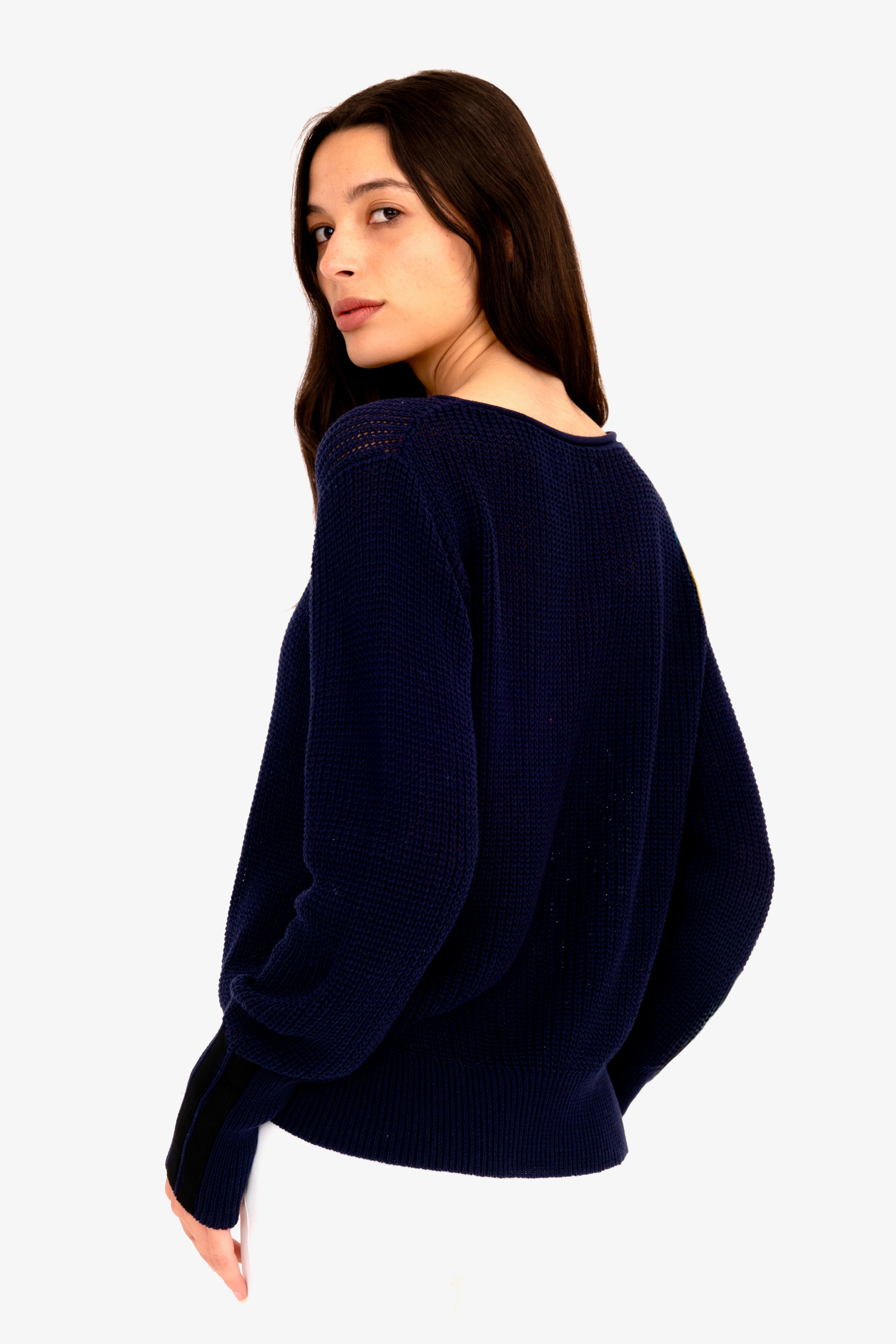 Woman wearing a dark blue sweater on a white background