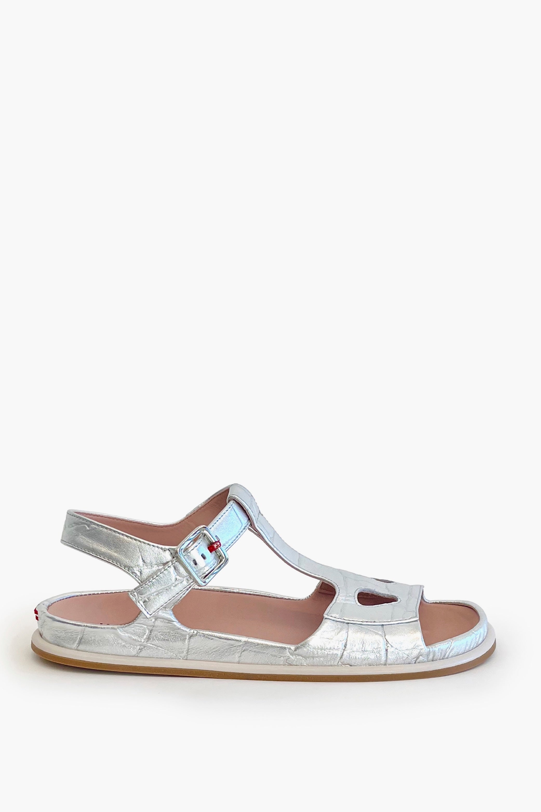 Silver croco ankle strap flat sandal on a white background