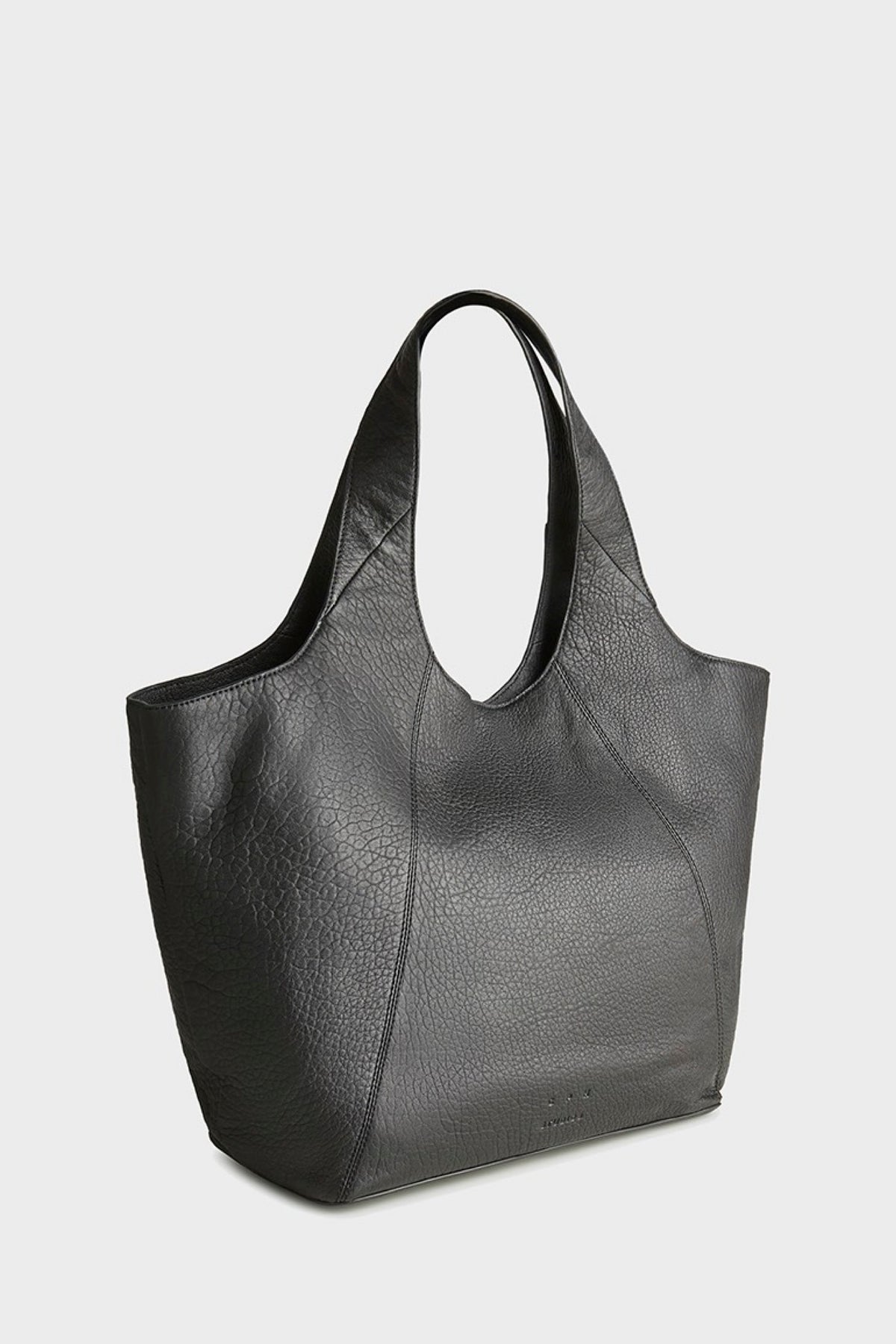 A black pebbled leather slouchy tote bag with double shoulder straps, shown from a three-quarters angle on a light gray background.