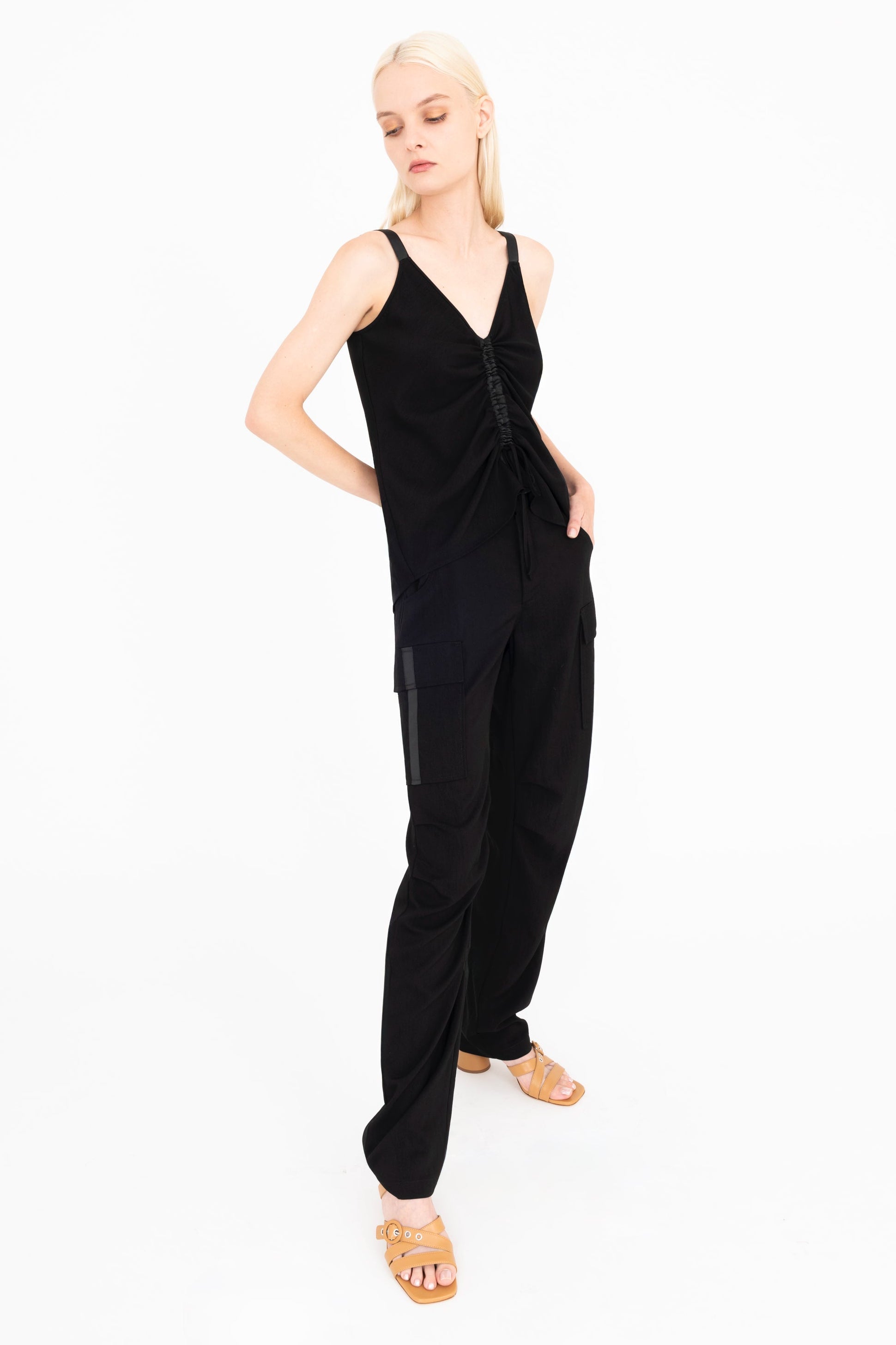 Woman wearing a black outfit on a white background
