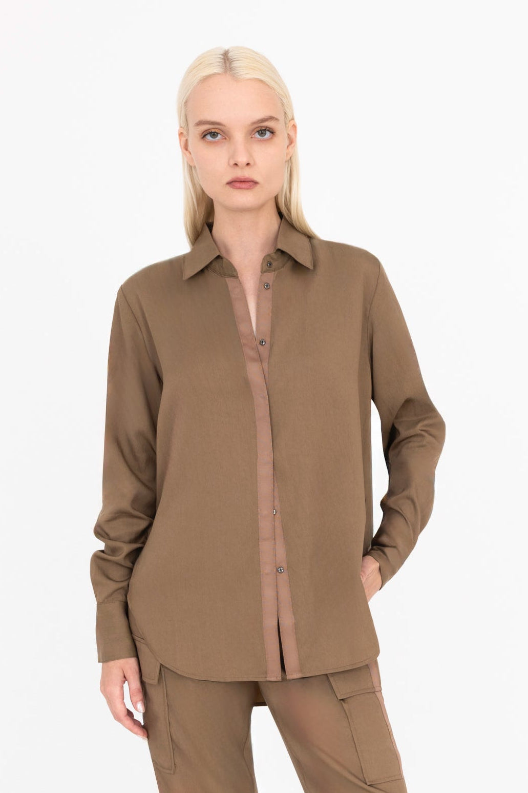Woman wearing a brown outfit on a white background