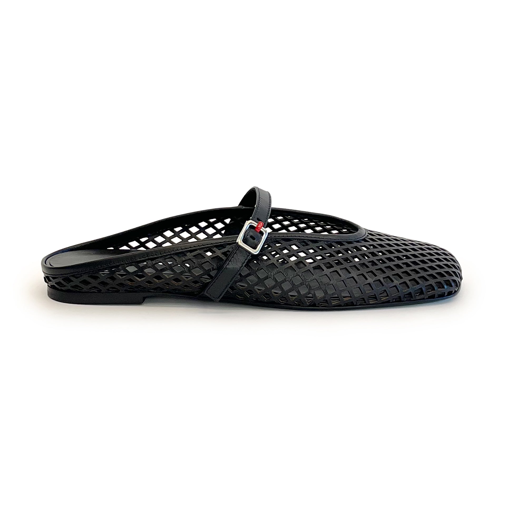 Black laser cut leather strap slip on flat shoe on a white background