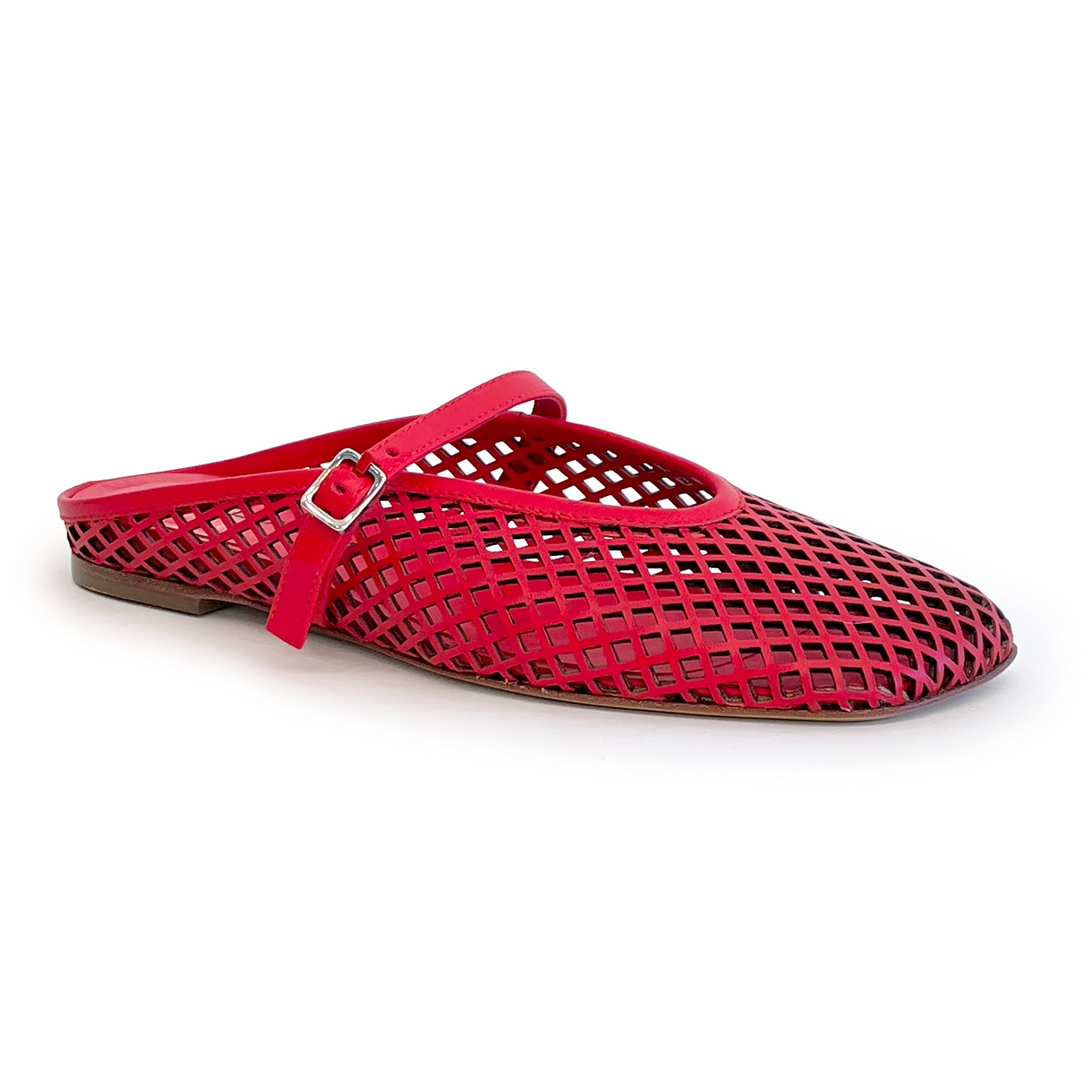 Red laser cut leather strap slip on flat shoe on a white background