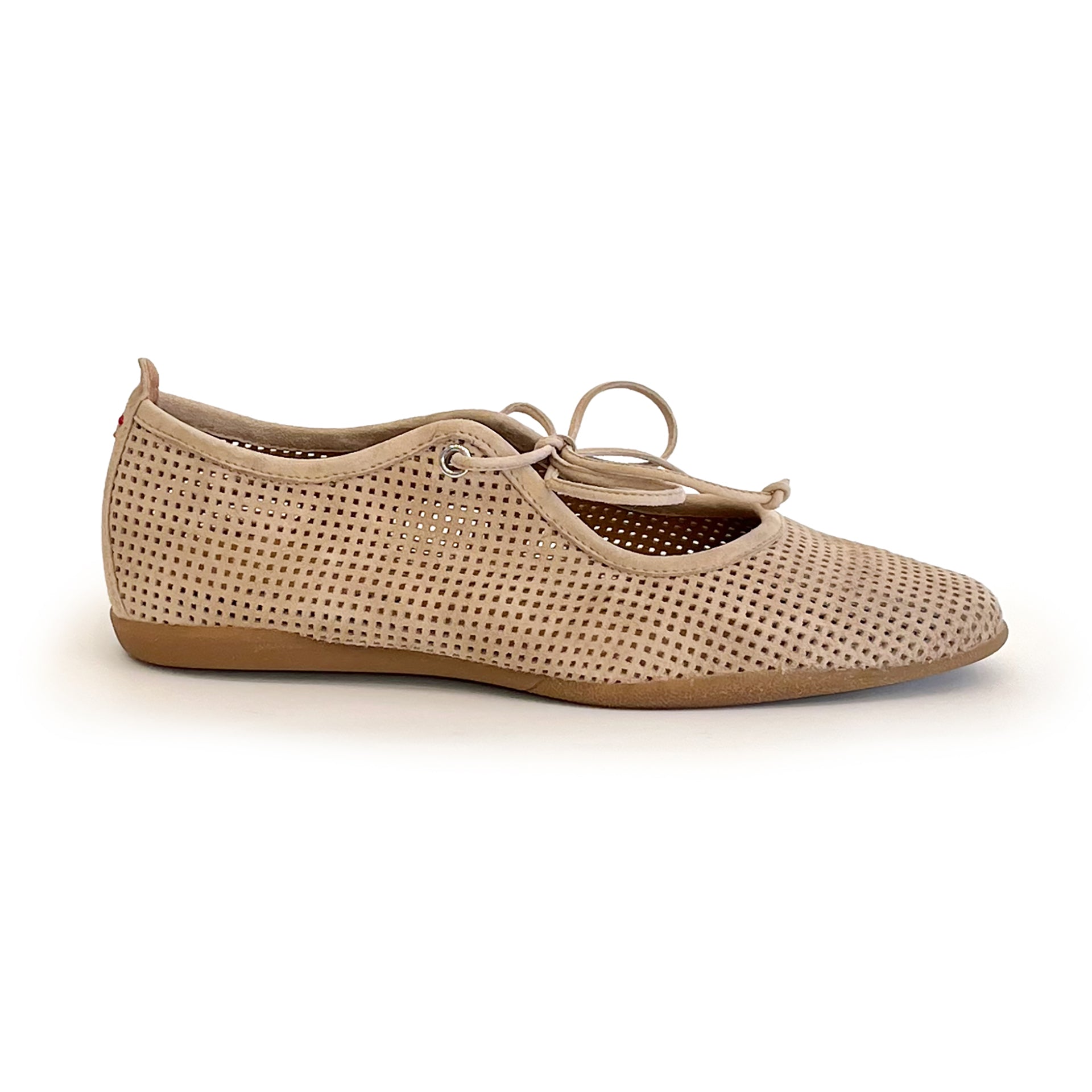 Beige perforated suede ballet flat shoe on a white background