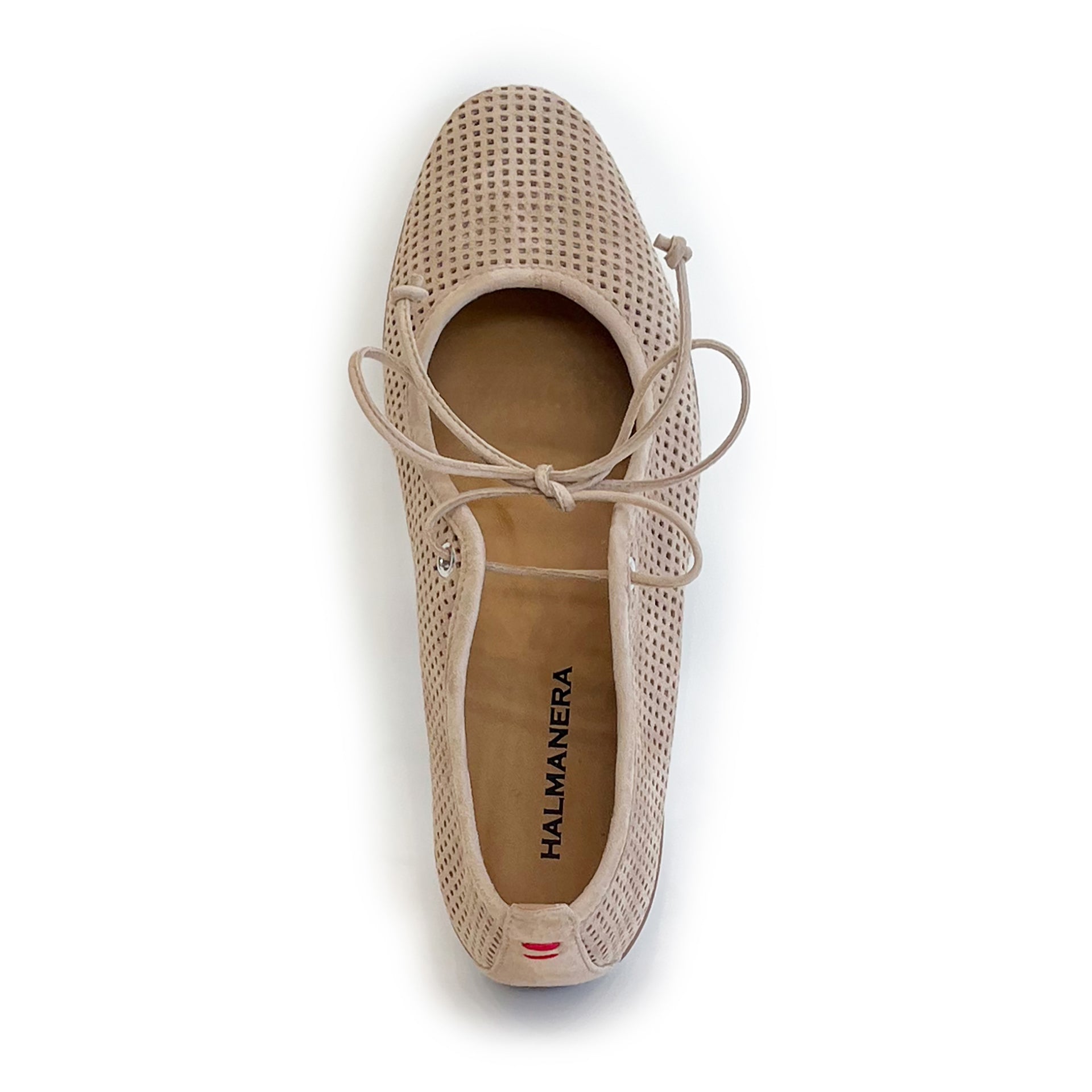 Beige perforated suede ballet flat shoe on a white background