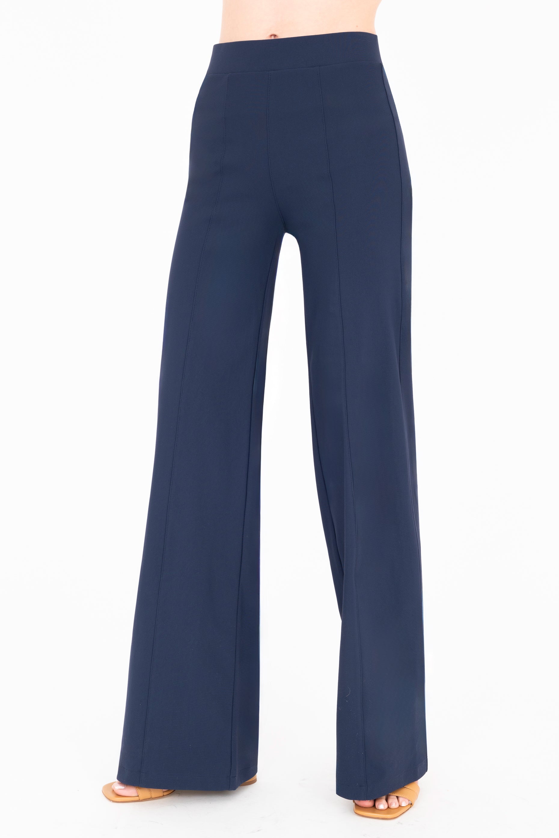 Quarter view of indigo blue wide-leg pants on a white background