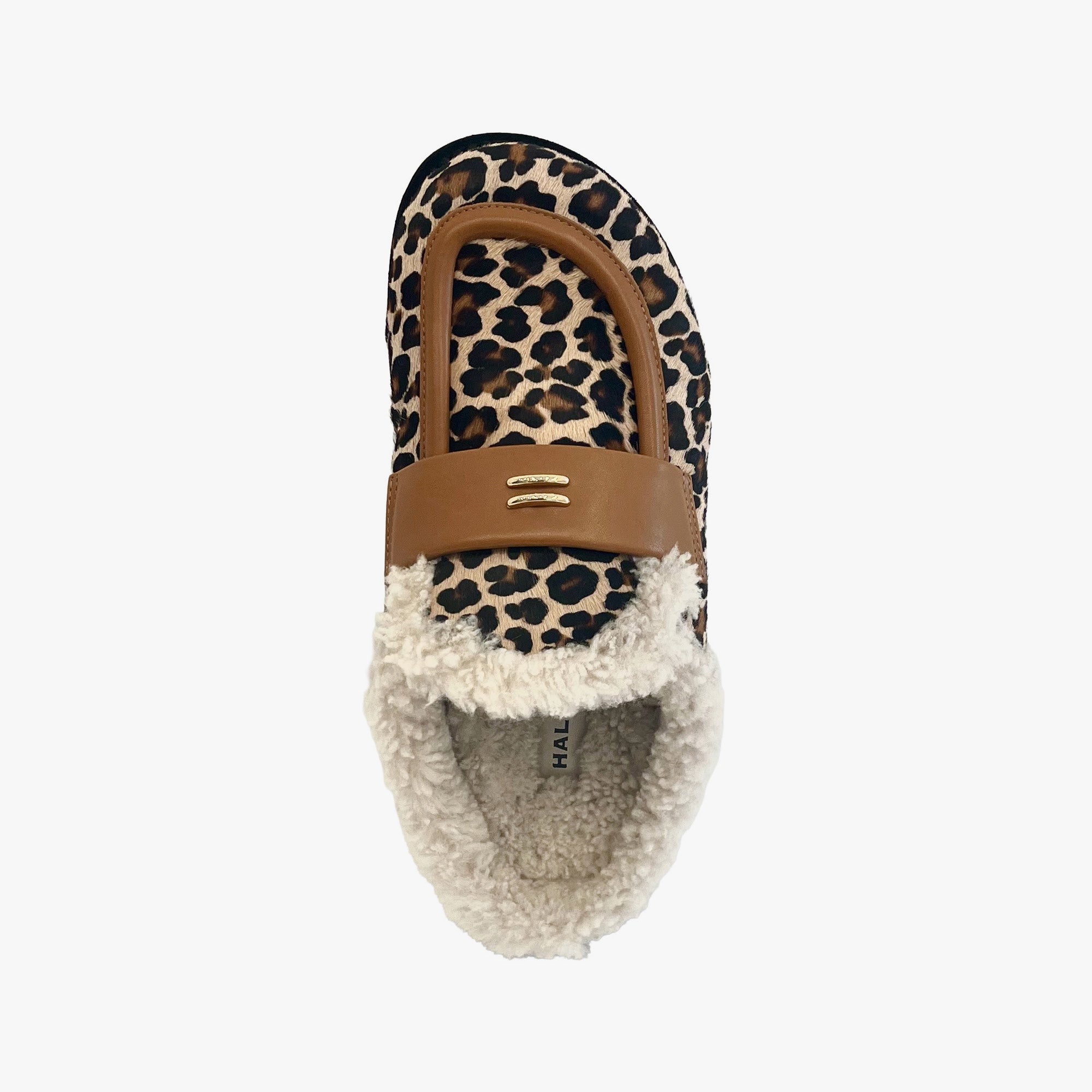 A single slip-on loafer-style shoe with a leopard print upper, tan leather strap, and fluffy cream sherpa lining, shown from a top-down view on a light gray background.