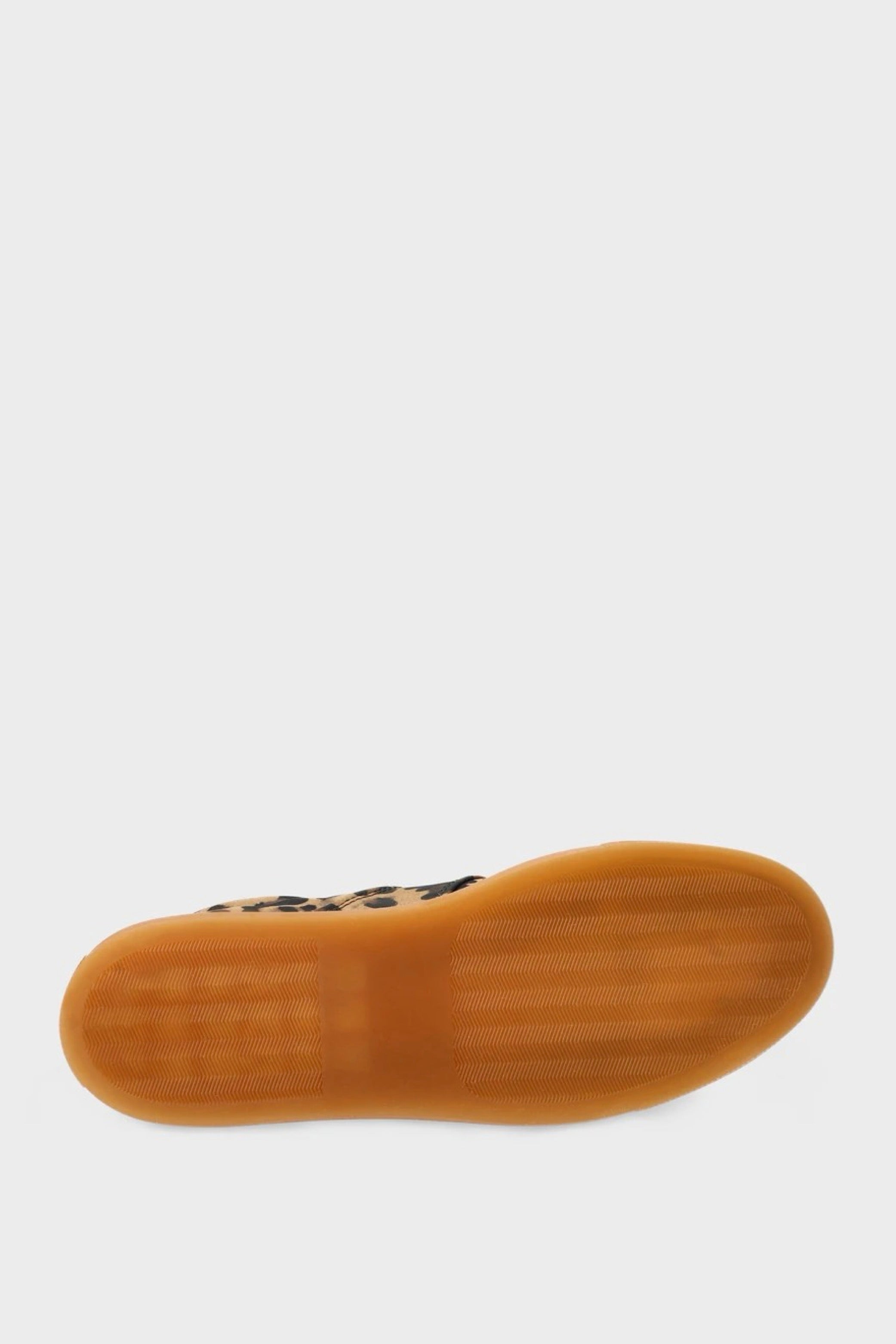 Brown sole of a shoe on a white background