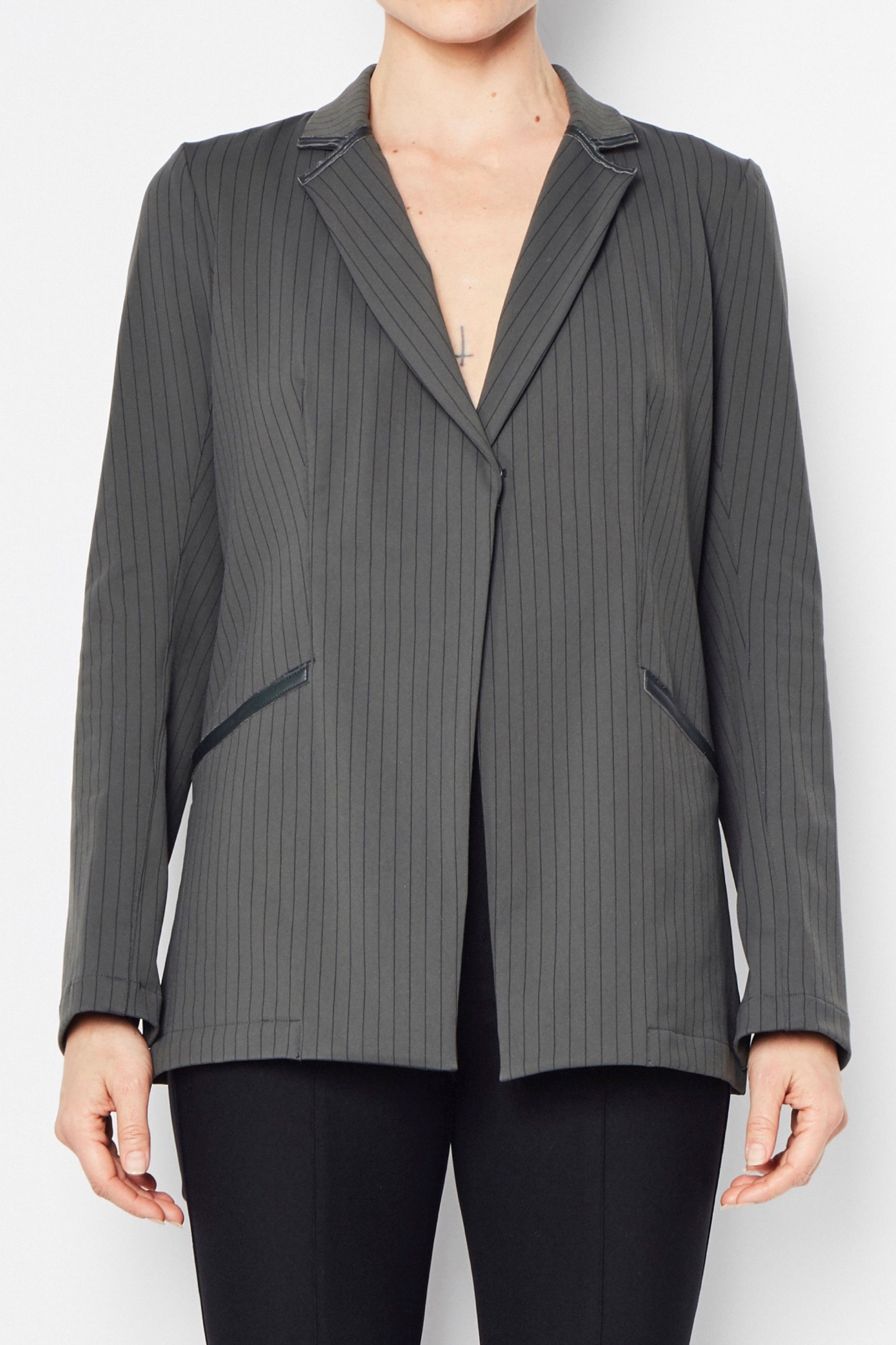 Gray pinstripe blazer worn on a white background