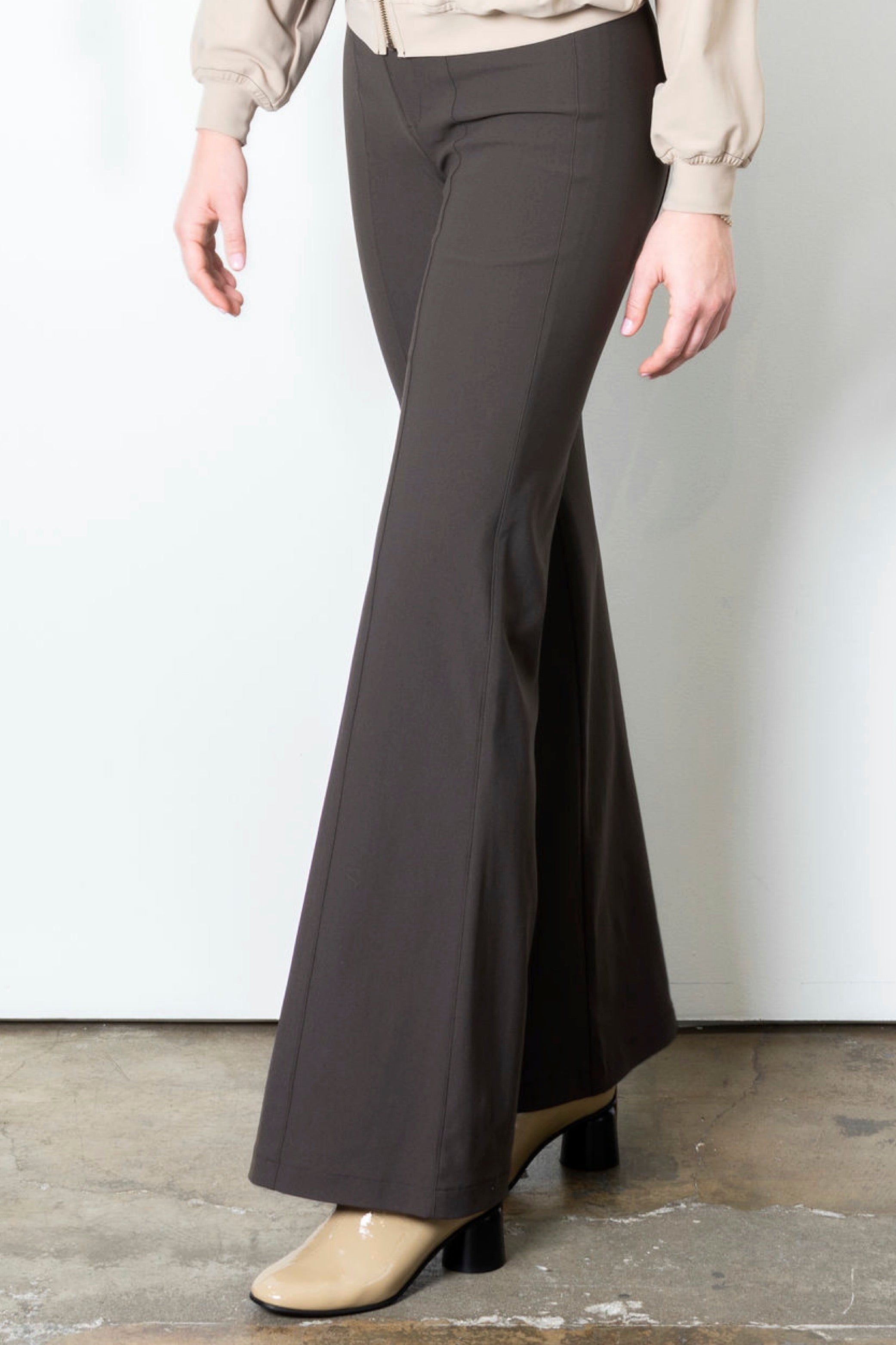 Brown wide leg pants on a plain background