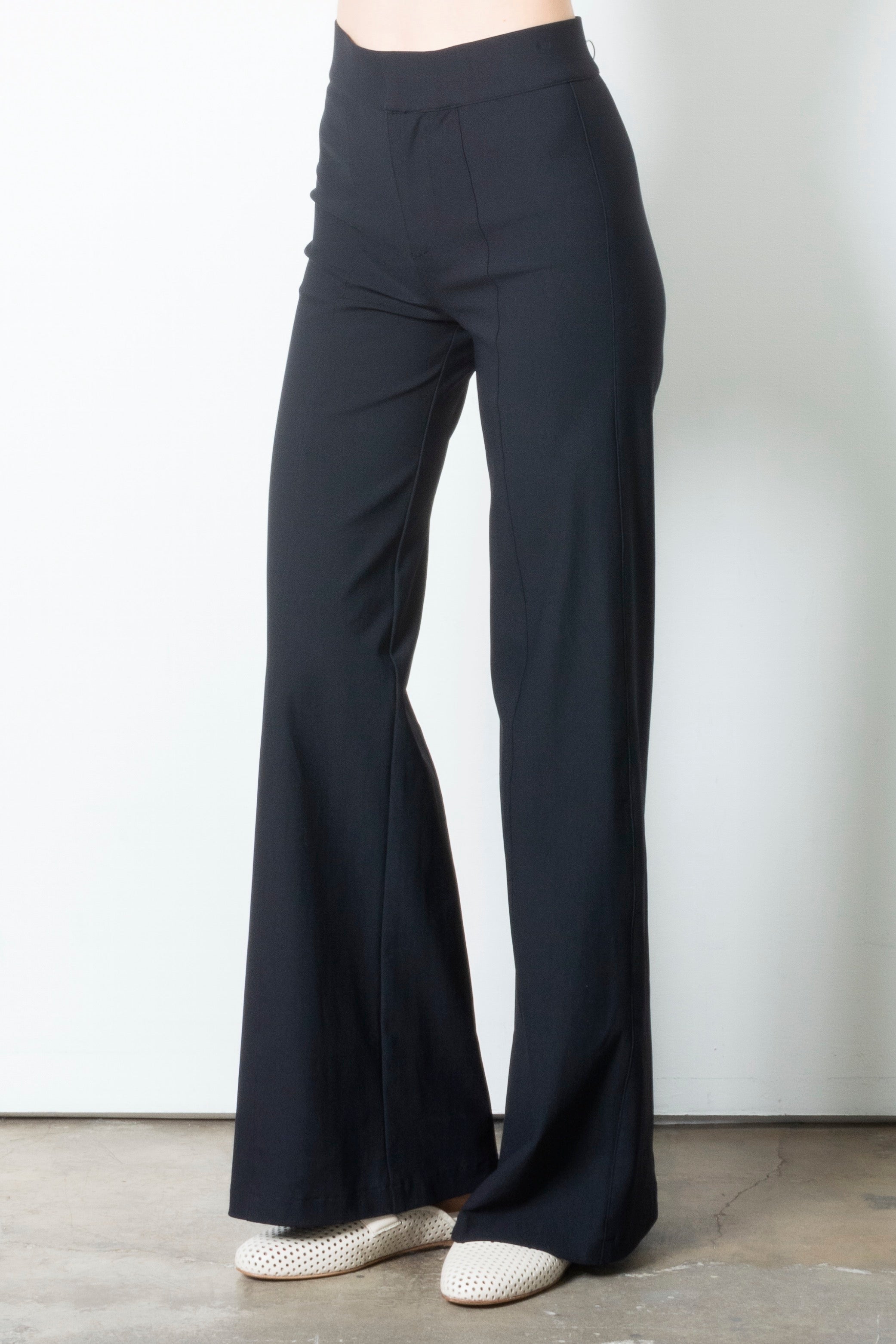 Black wide-leg pants on a plain background