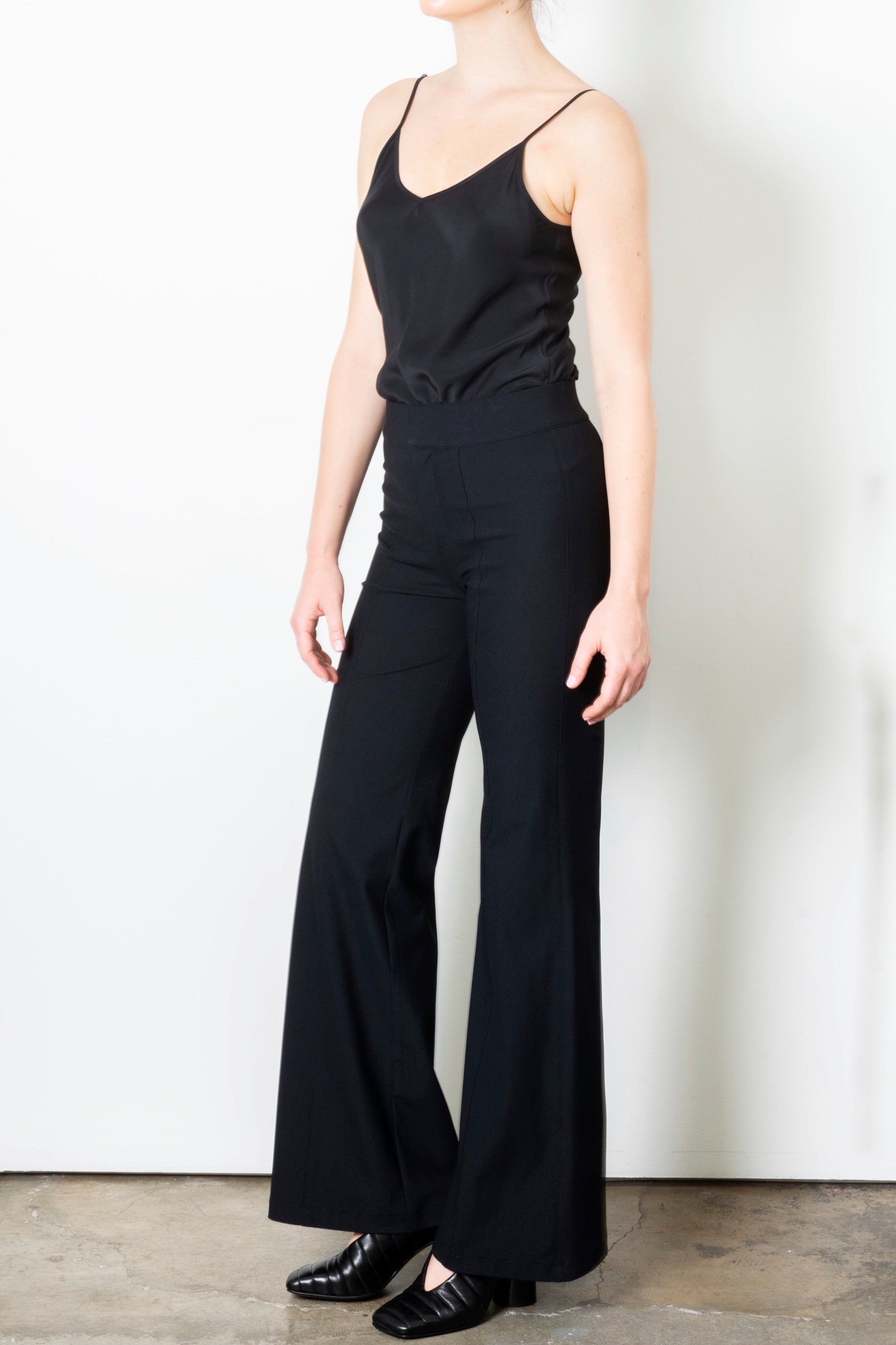 Black wide-leg pants on a plain background
