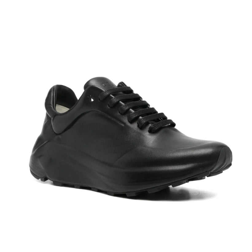 Black leather shoe on a white background