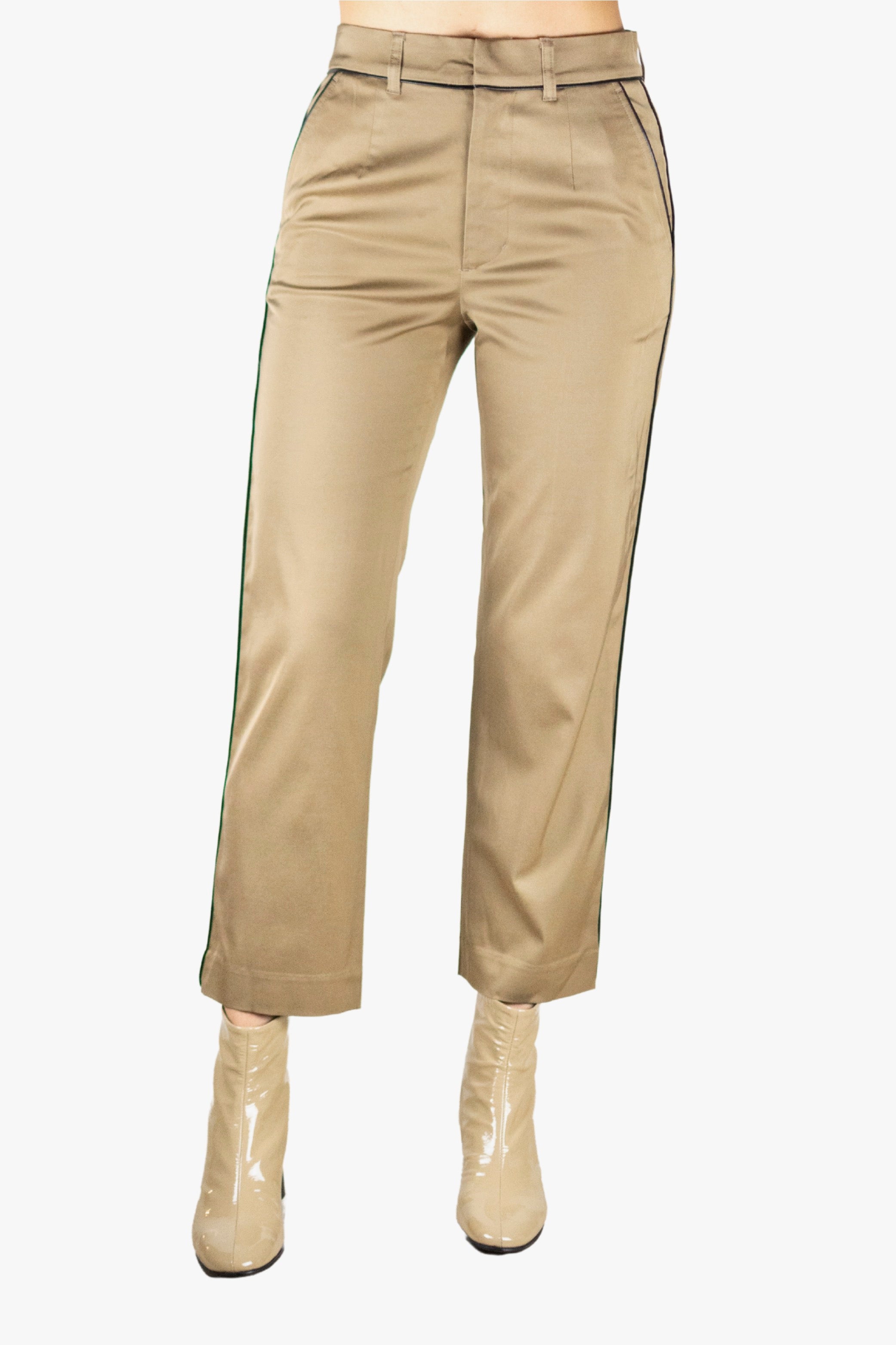 Beige pants with beige boots on a white background