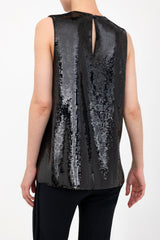 Black sequin sleeveless top worn by a model on a white background