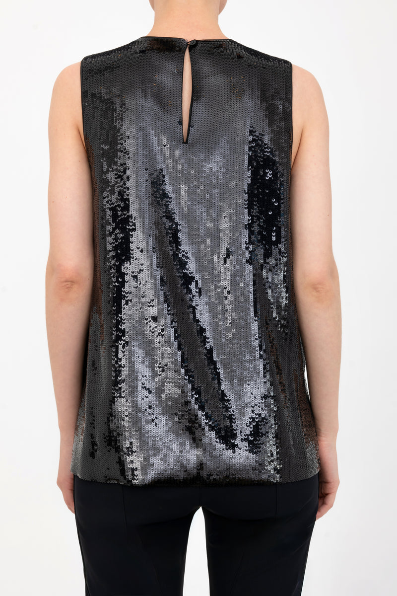 Black sequin sleeveless top worn by a model on a white background