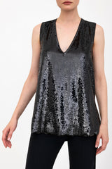 Black sequin sleeveless top worn by a model on a white background