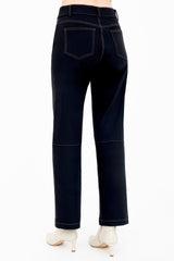 Black jeans worn by a person on a white background