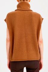 Brown knitted vest worn by a person on a white background
