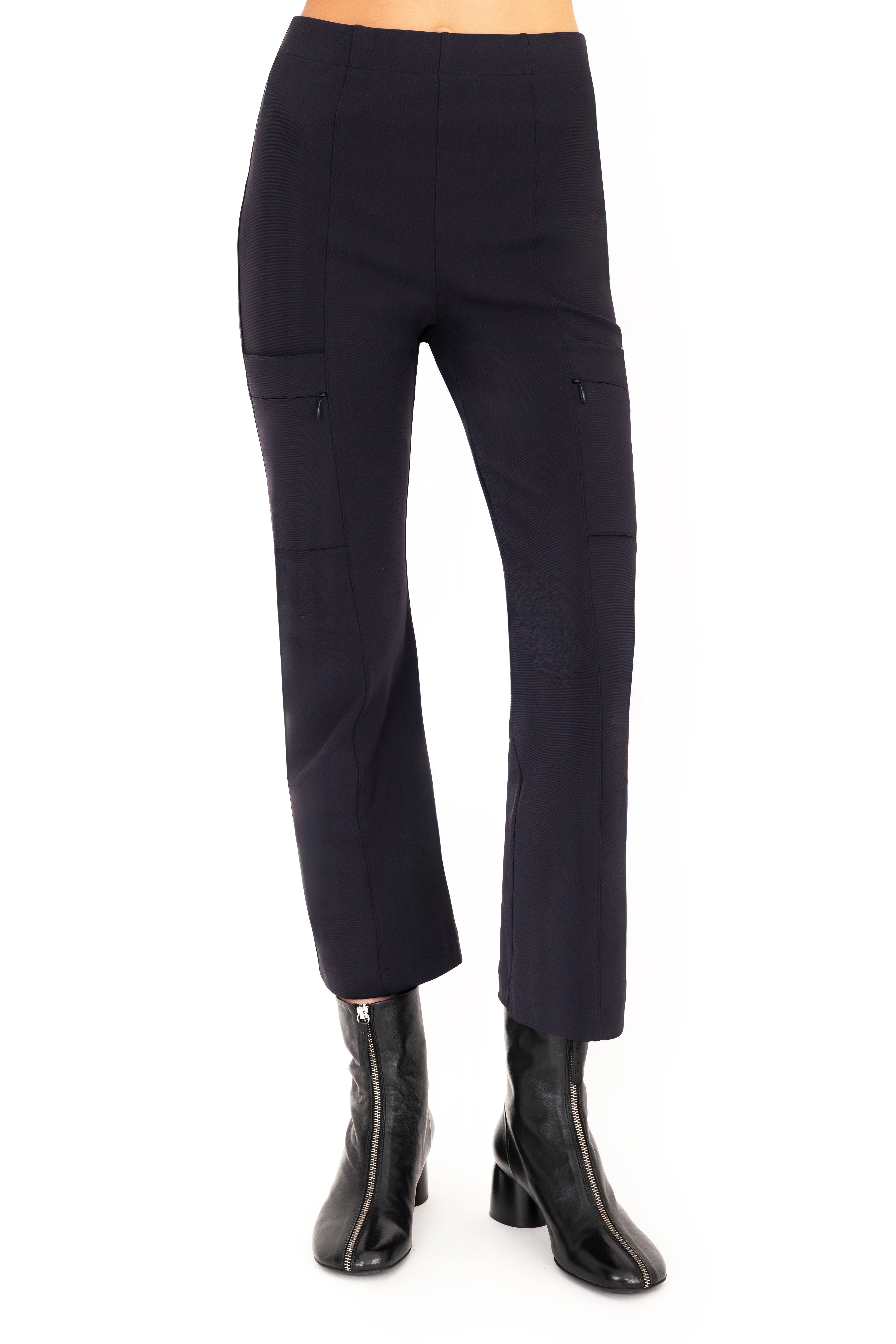 Dark blue pants worn by a person on a white background
