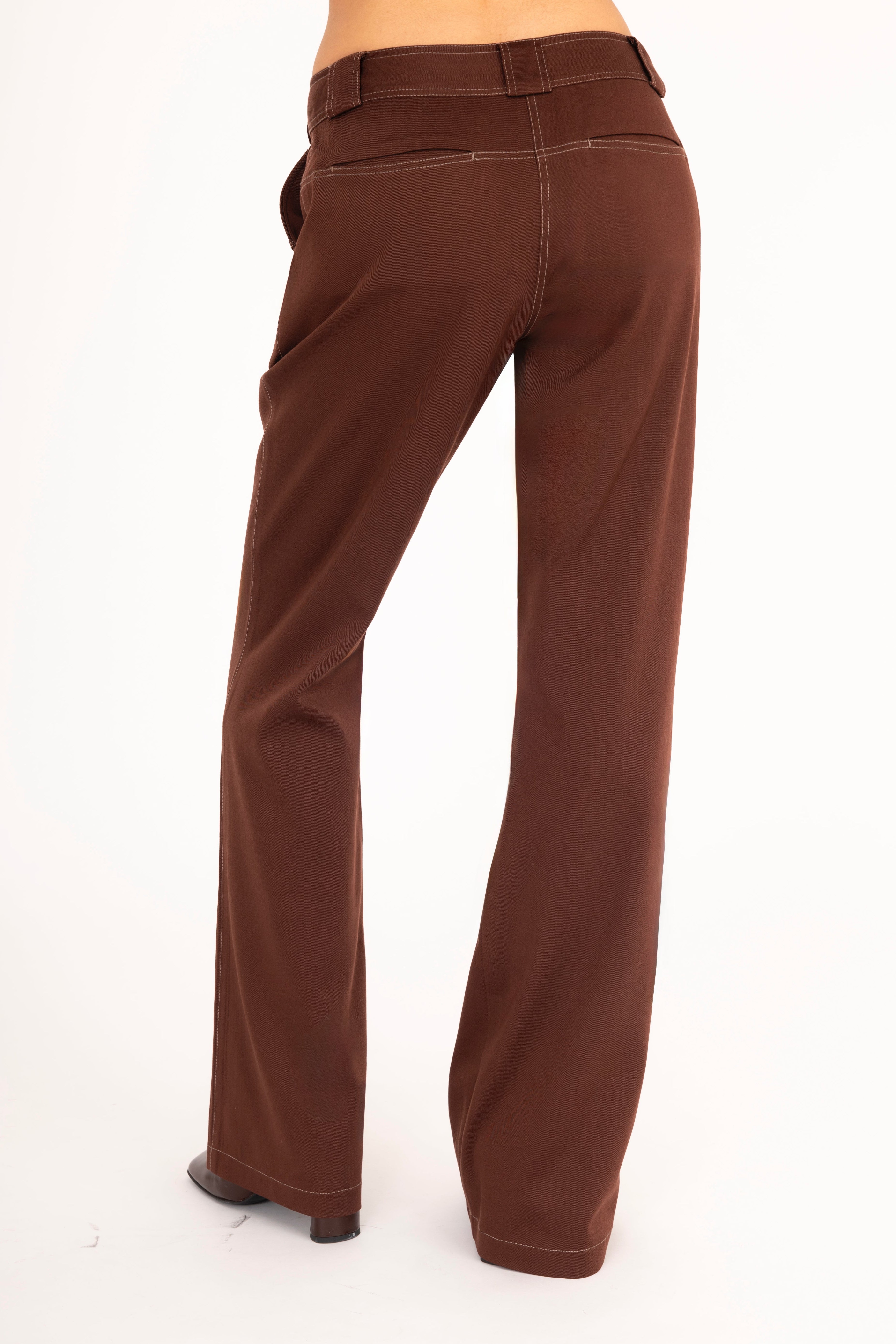 Brown flared jeans on a white background