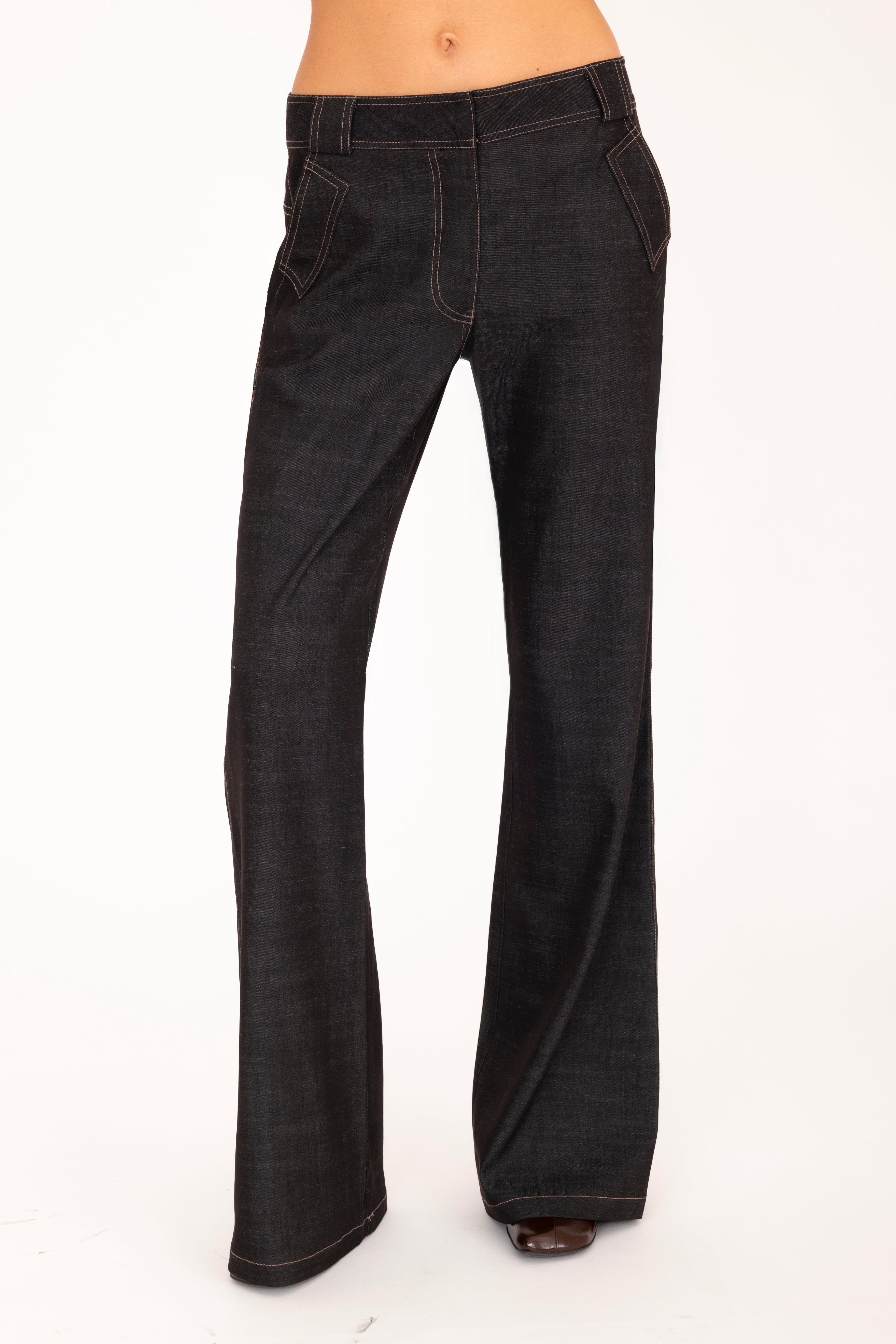 Black flared jeans on a white background