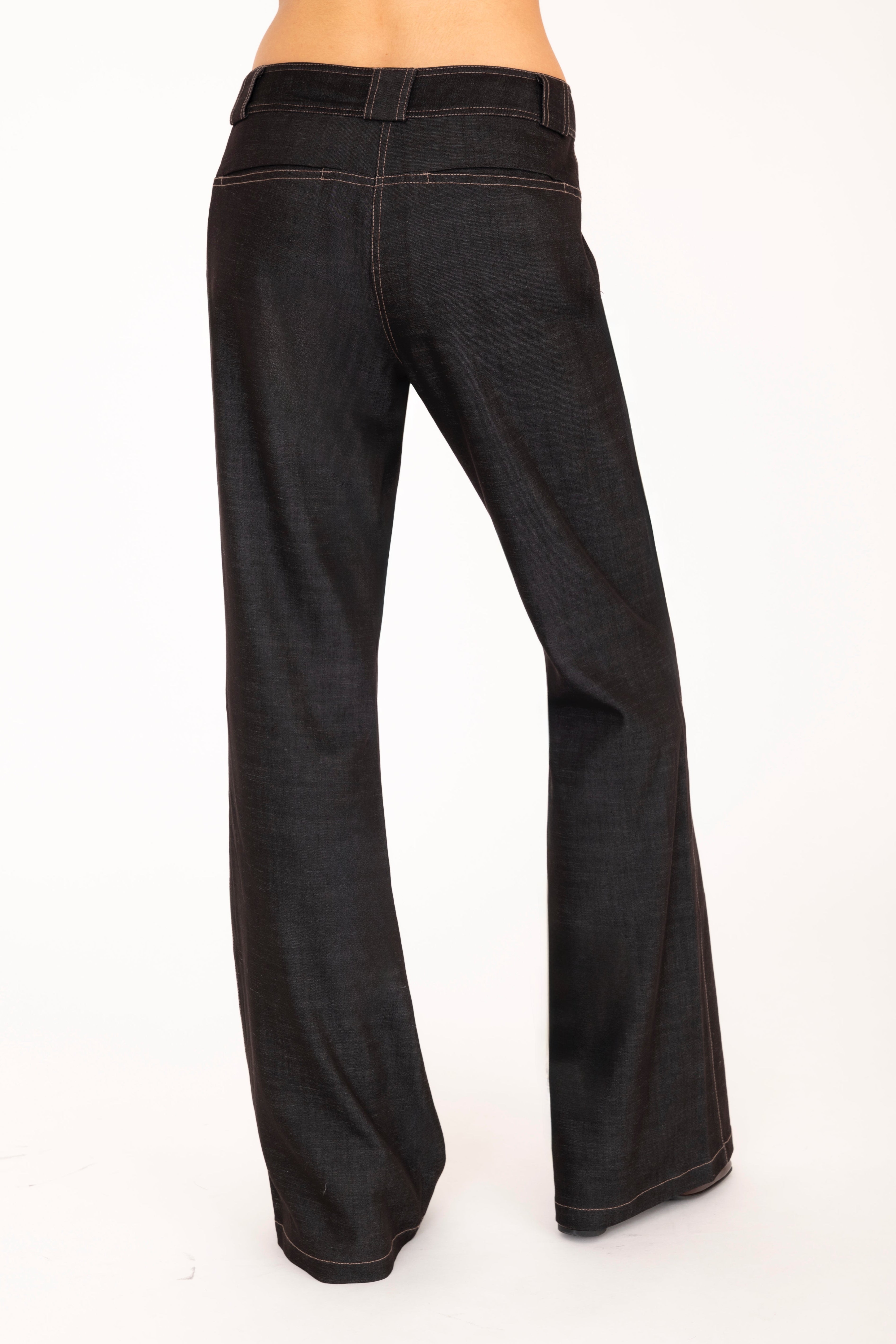 Brown flared jeans on a white background