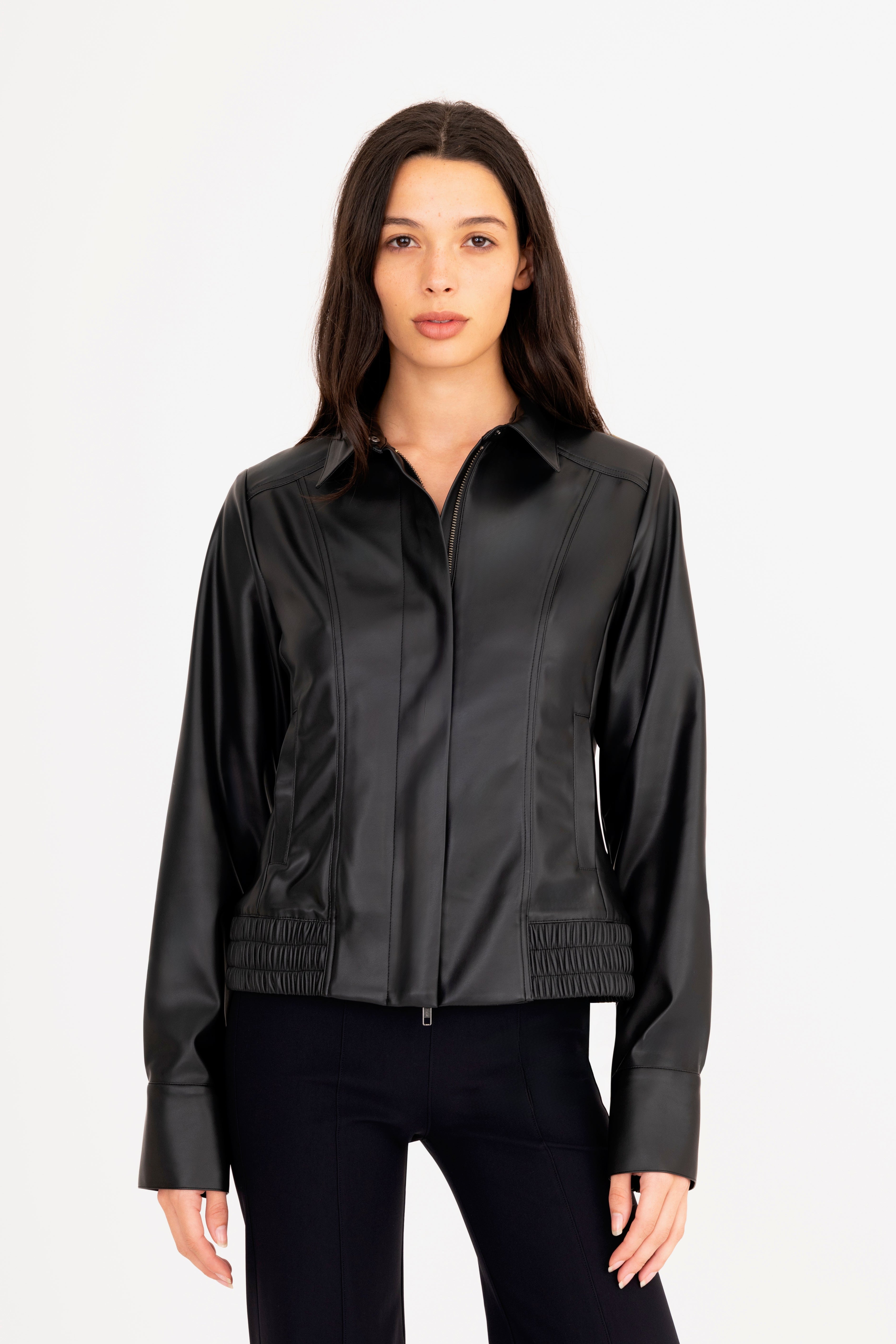 Woman wearing a black jacket on a white background