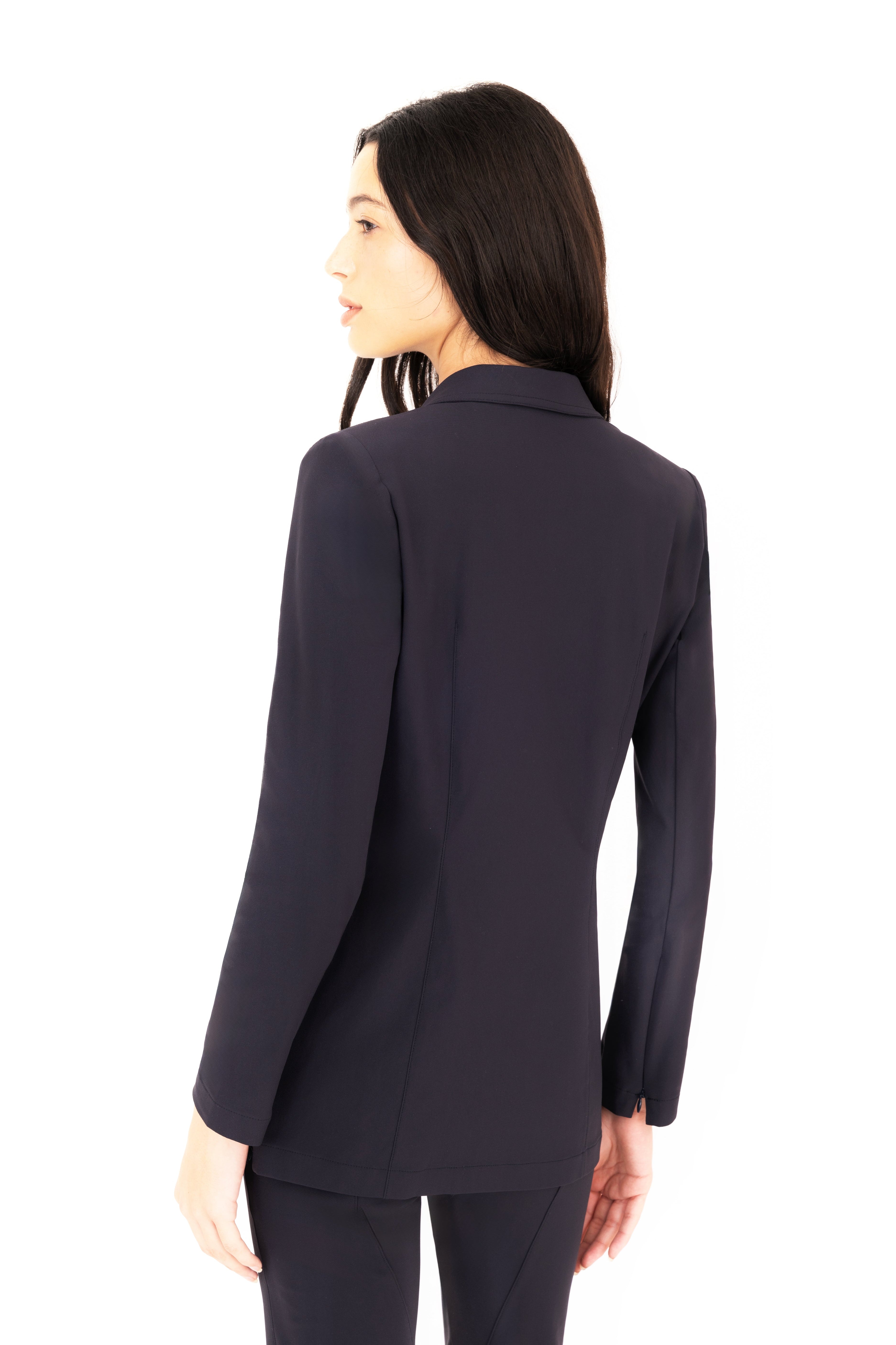 Woman wearing a dark blue suit on a white background