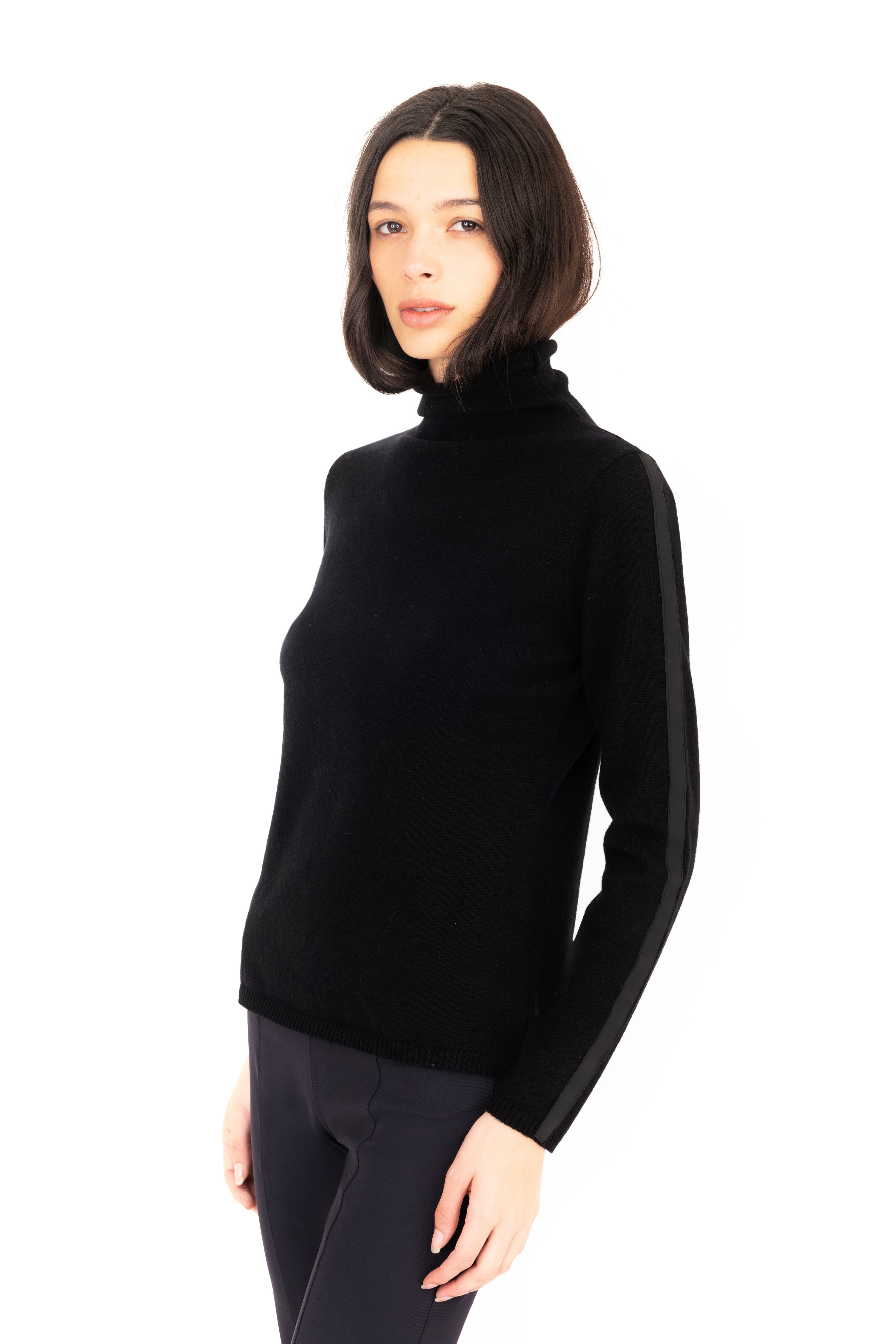 Woman wearing a black turtleneck sweater on a white background