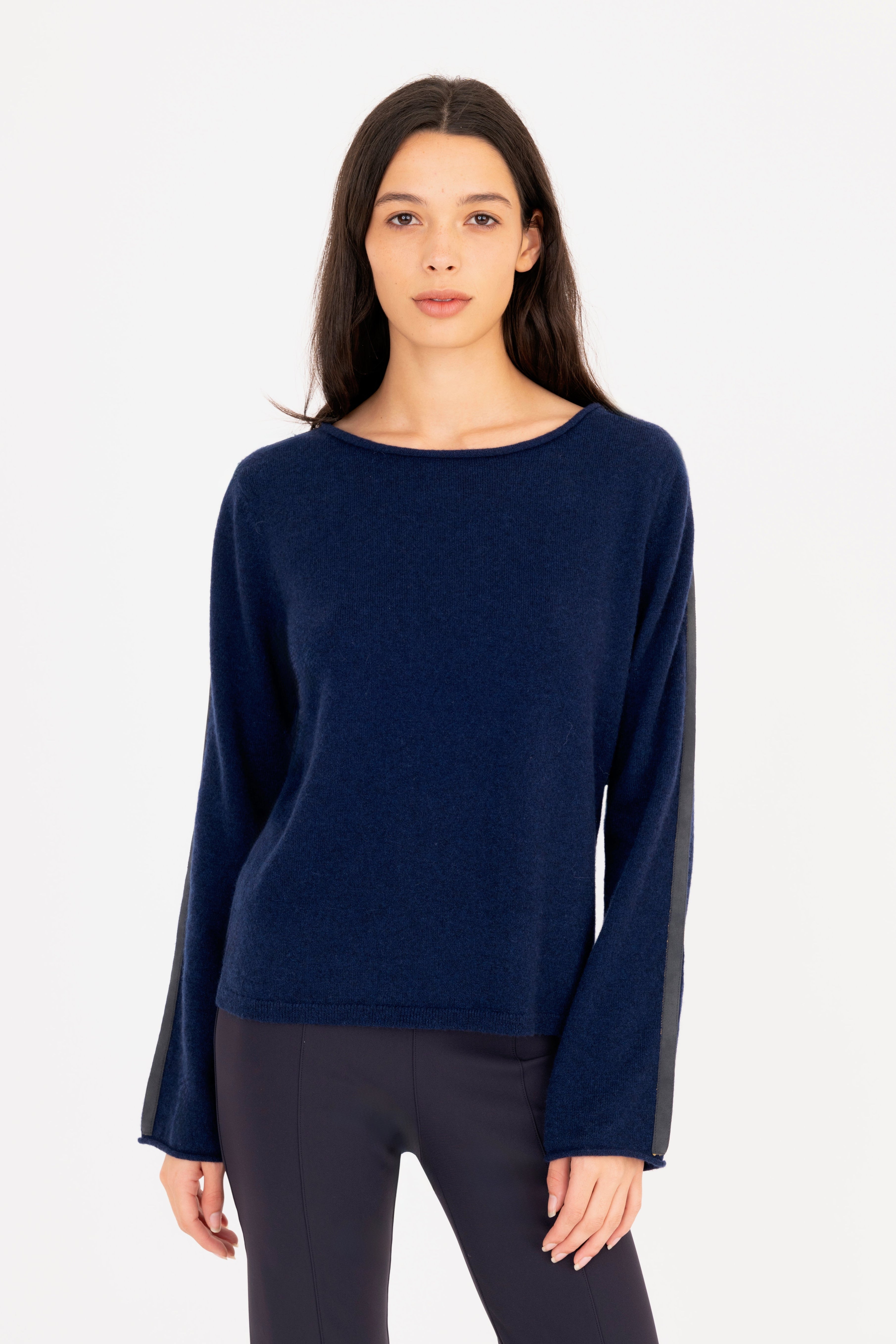 Woman wearing a blue sweater on a white background