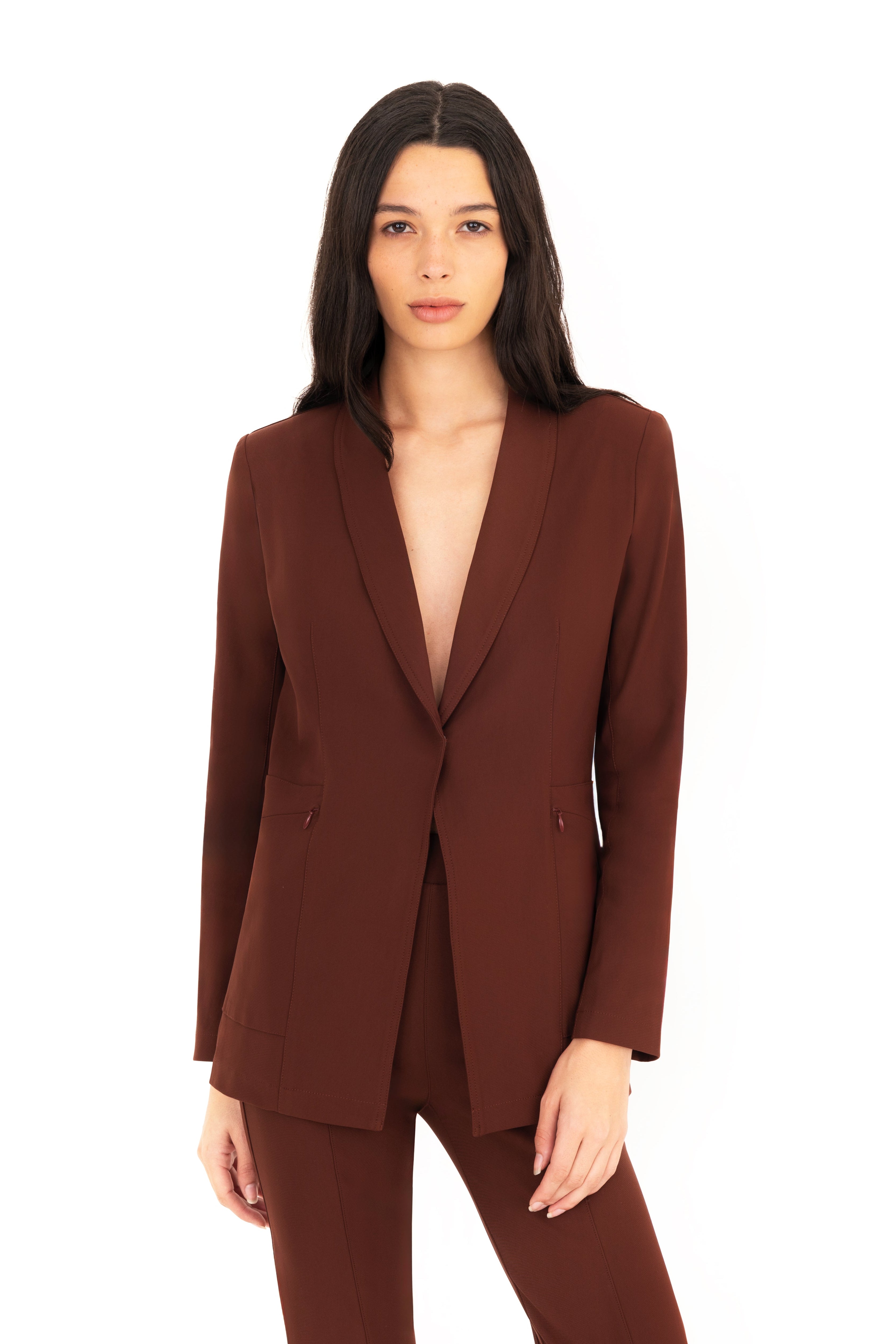 Woman wearing a brown suit on a white background