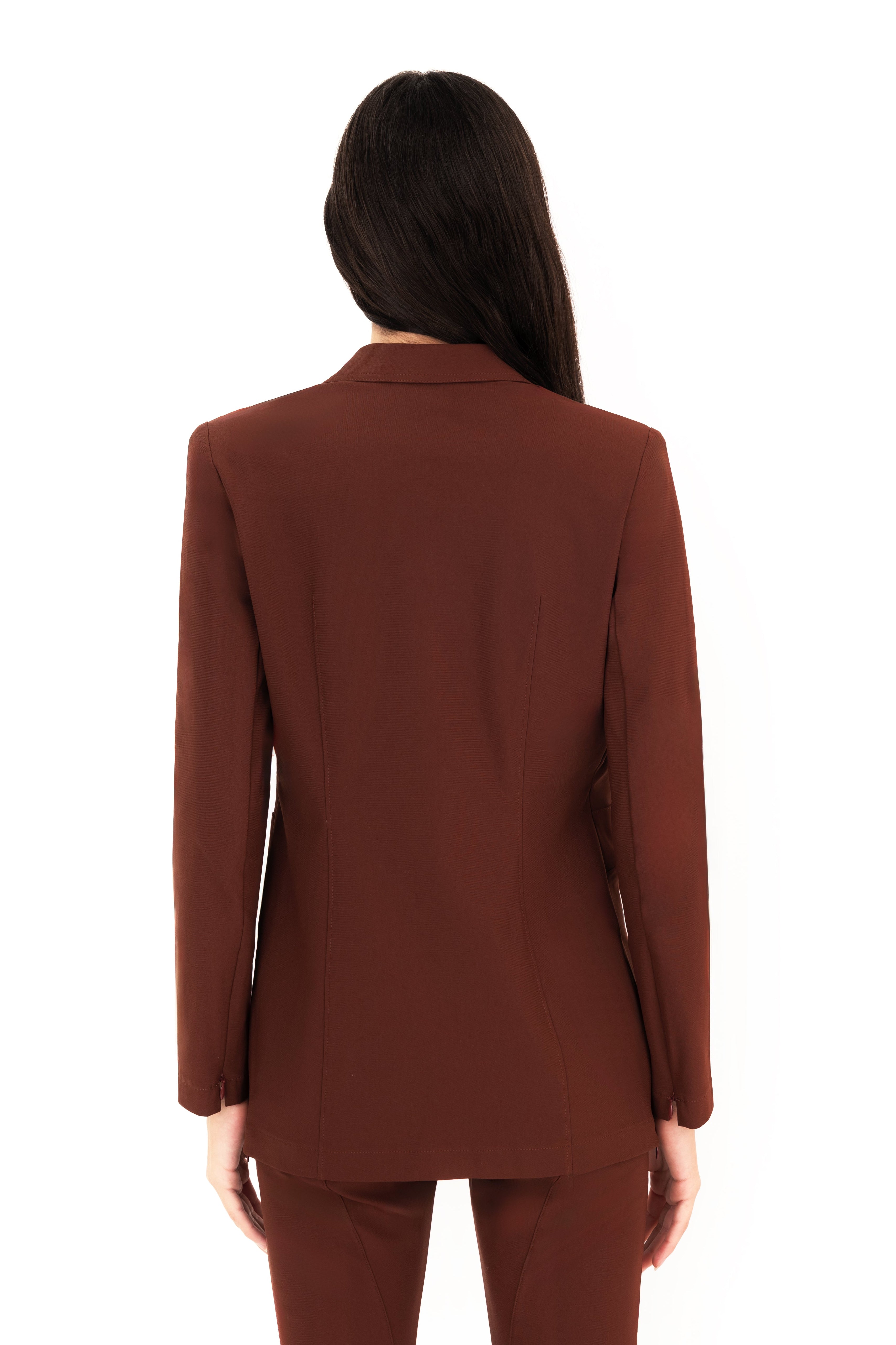 Brown suit worn by a person on a white background