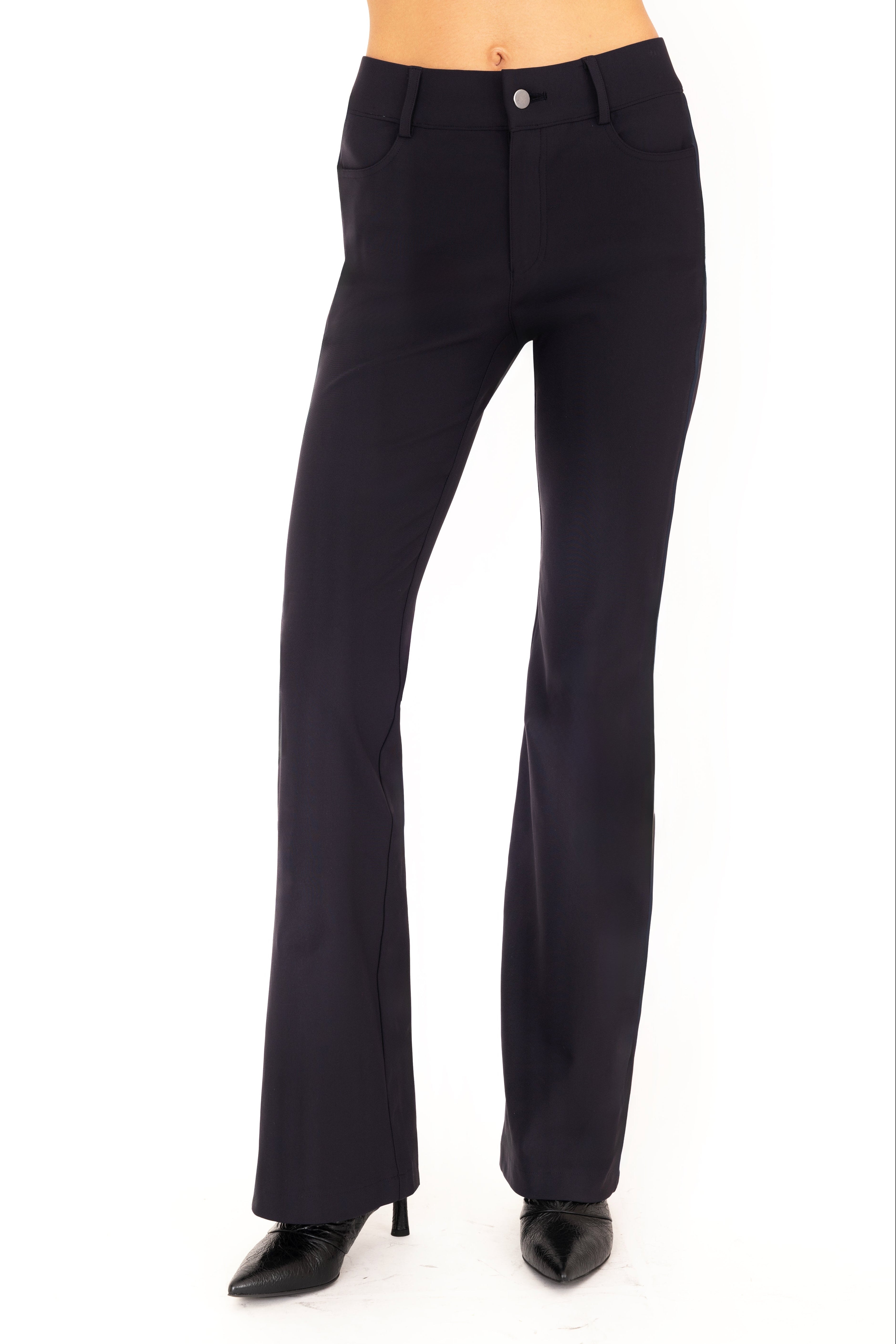 Dark blue pants worn by a person on a white background