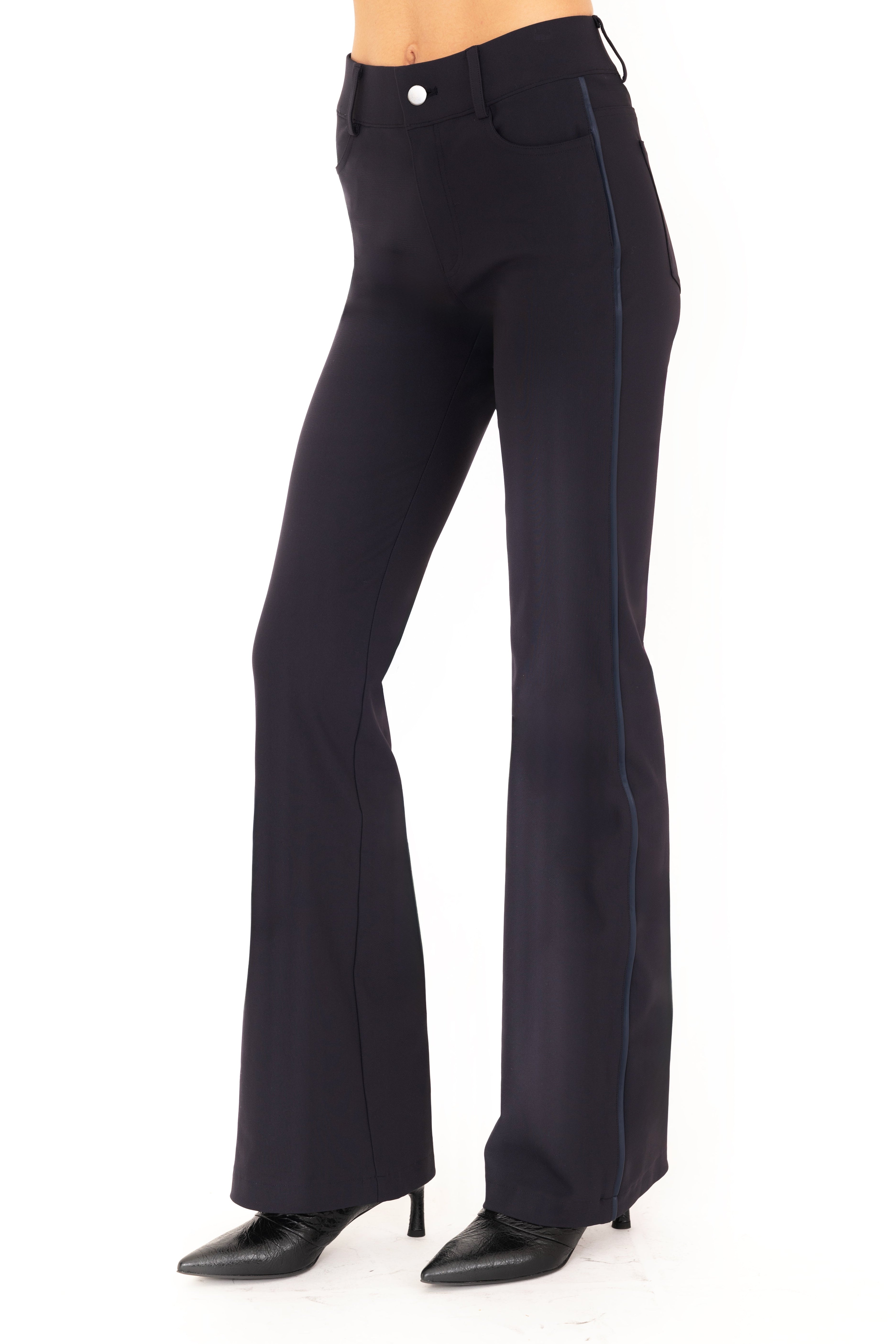 Dark blue pants worn by a person on a white background