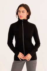 Woman wearing a black turtleneck sweater on a white background