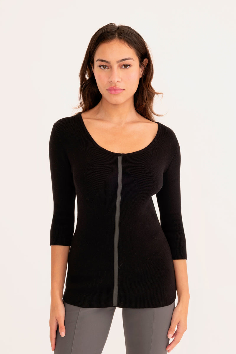 Woman wearing a black sweater white background